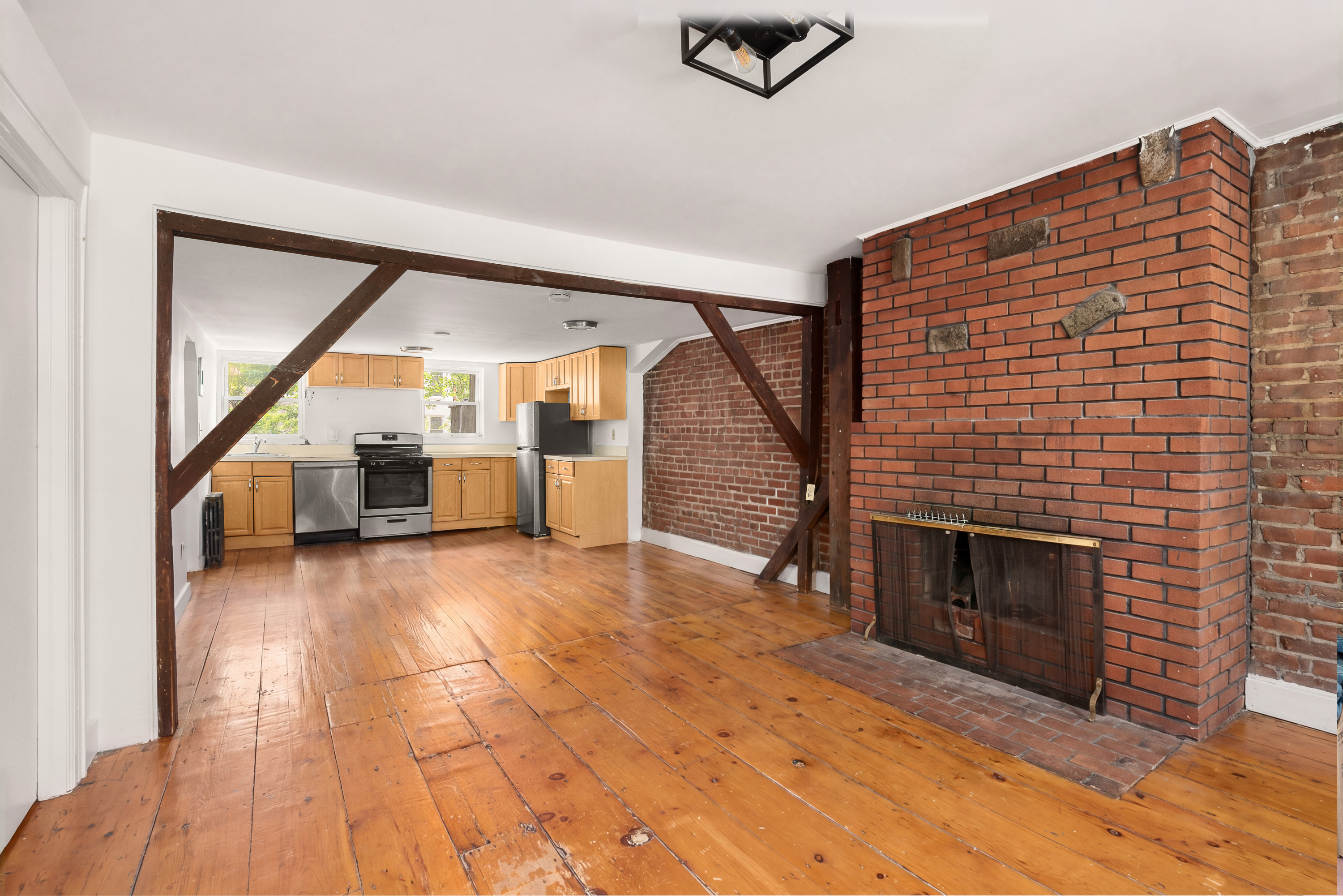 38 Douglass Street Brooklyn, NY 11231 - Photo 17 of 20 a view of empty room with stairs and fireplace