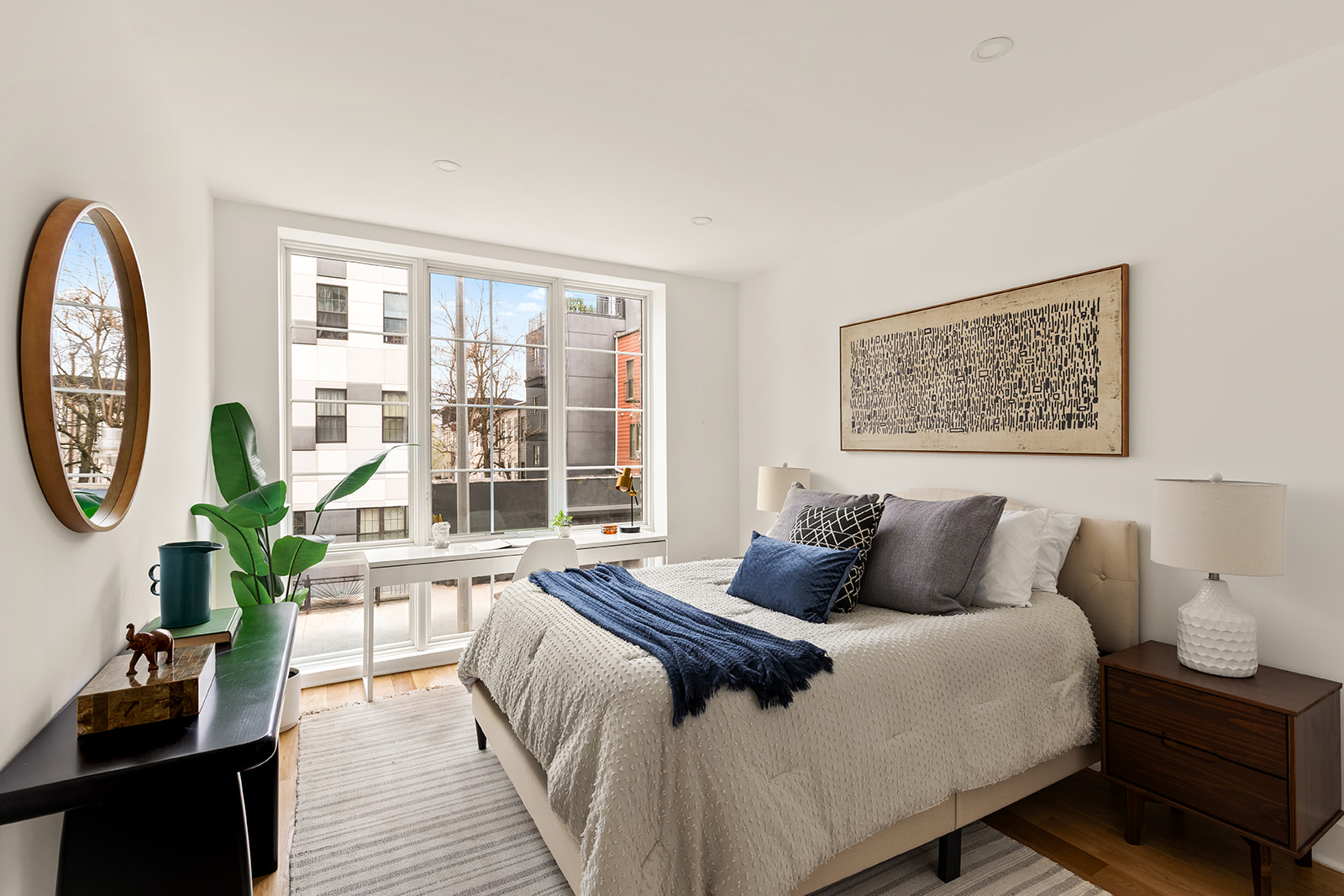 40 Schaefer Street, Unit 2A Brooklyn, NY 11207 - Photo 5 of 9 a bedroom with a large bed and a large window