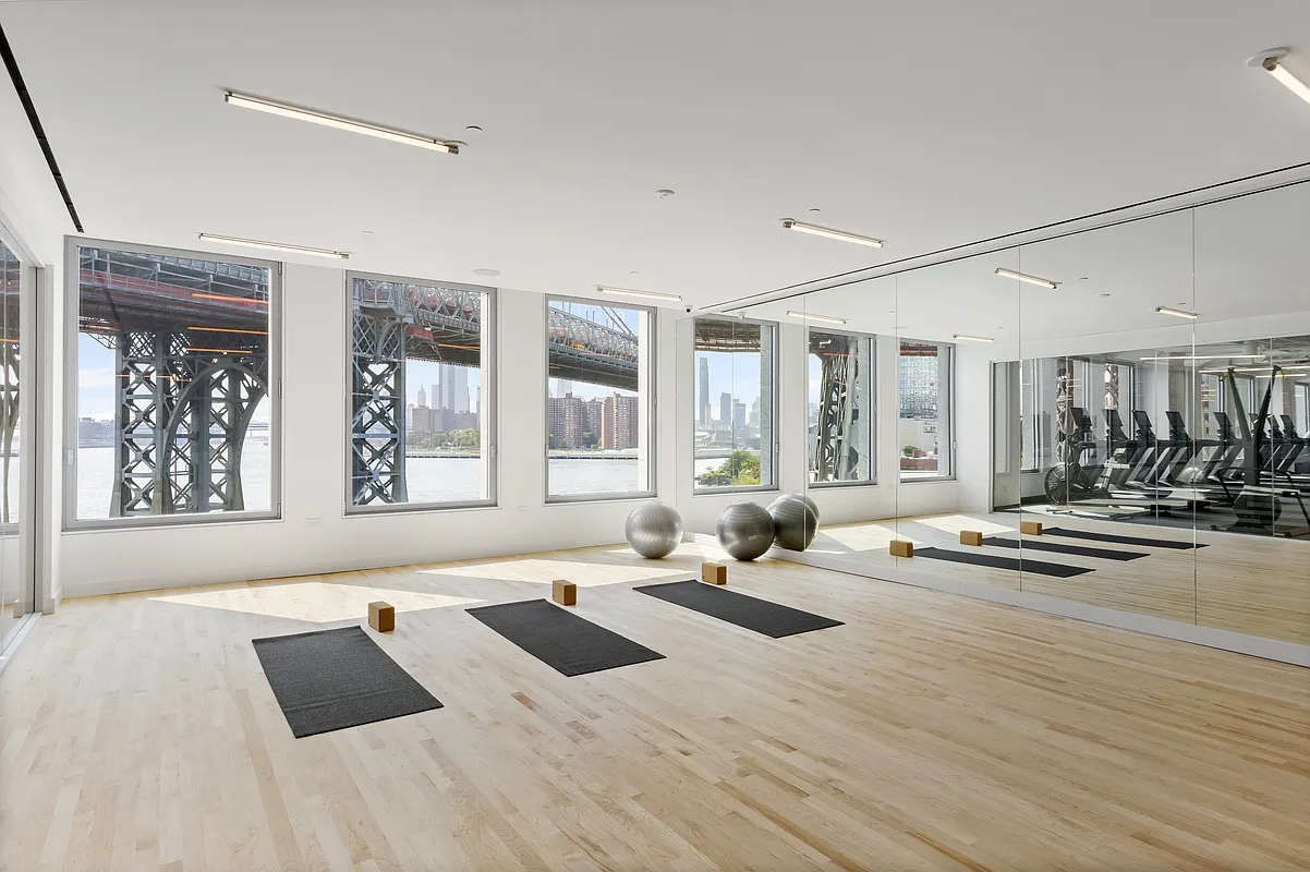 8 South 4th Street, Unit 15D Brooklyn, NY 11249 - Photo 20 of 29 a living room with furniture and windows