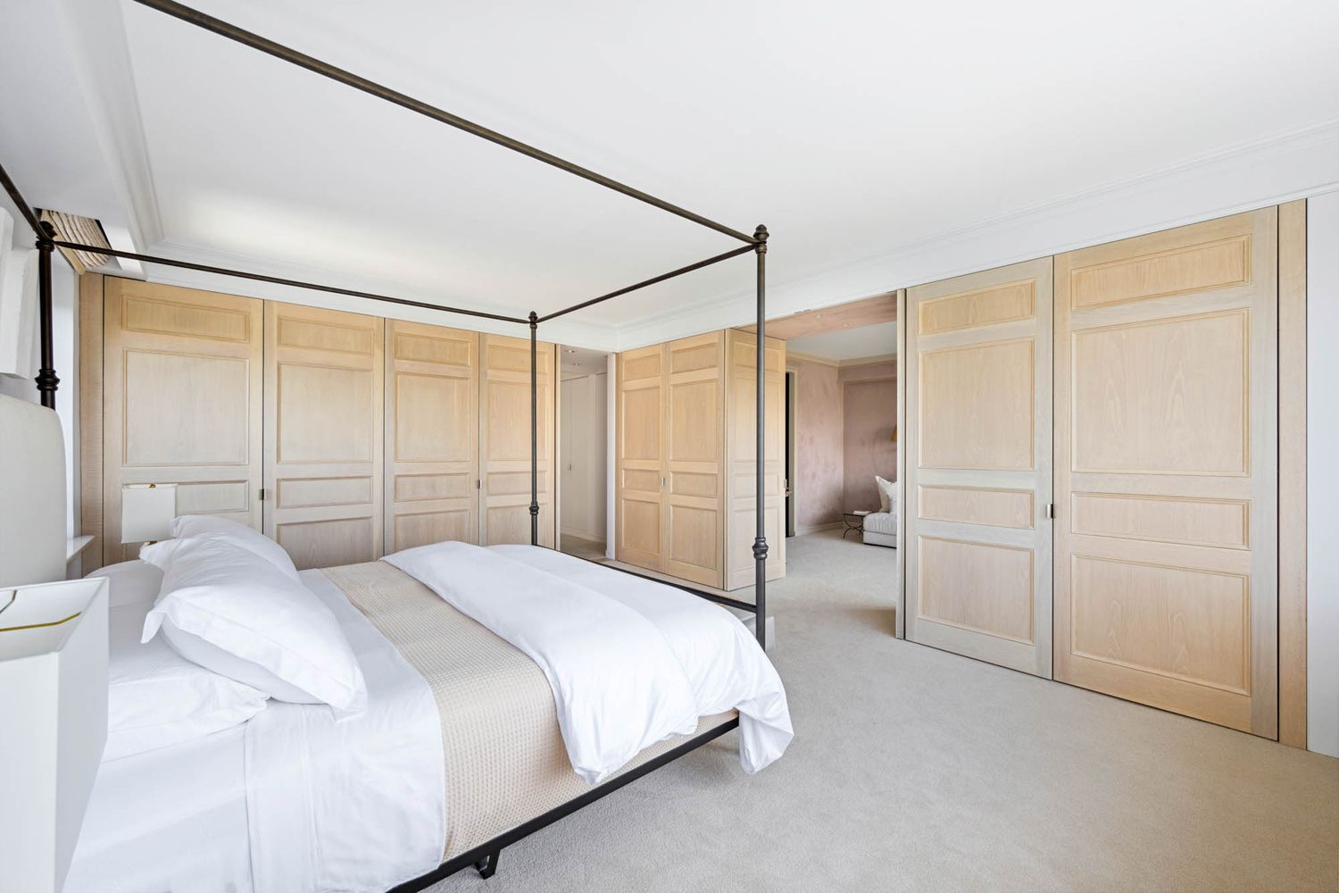 a spacious bathroom with a double vanity sink toilet mirror and bathtub
