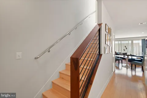 a kitchen with stainless steel appliances a sink stove and cabinets