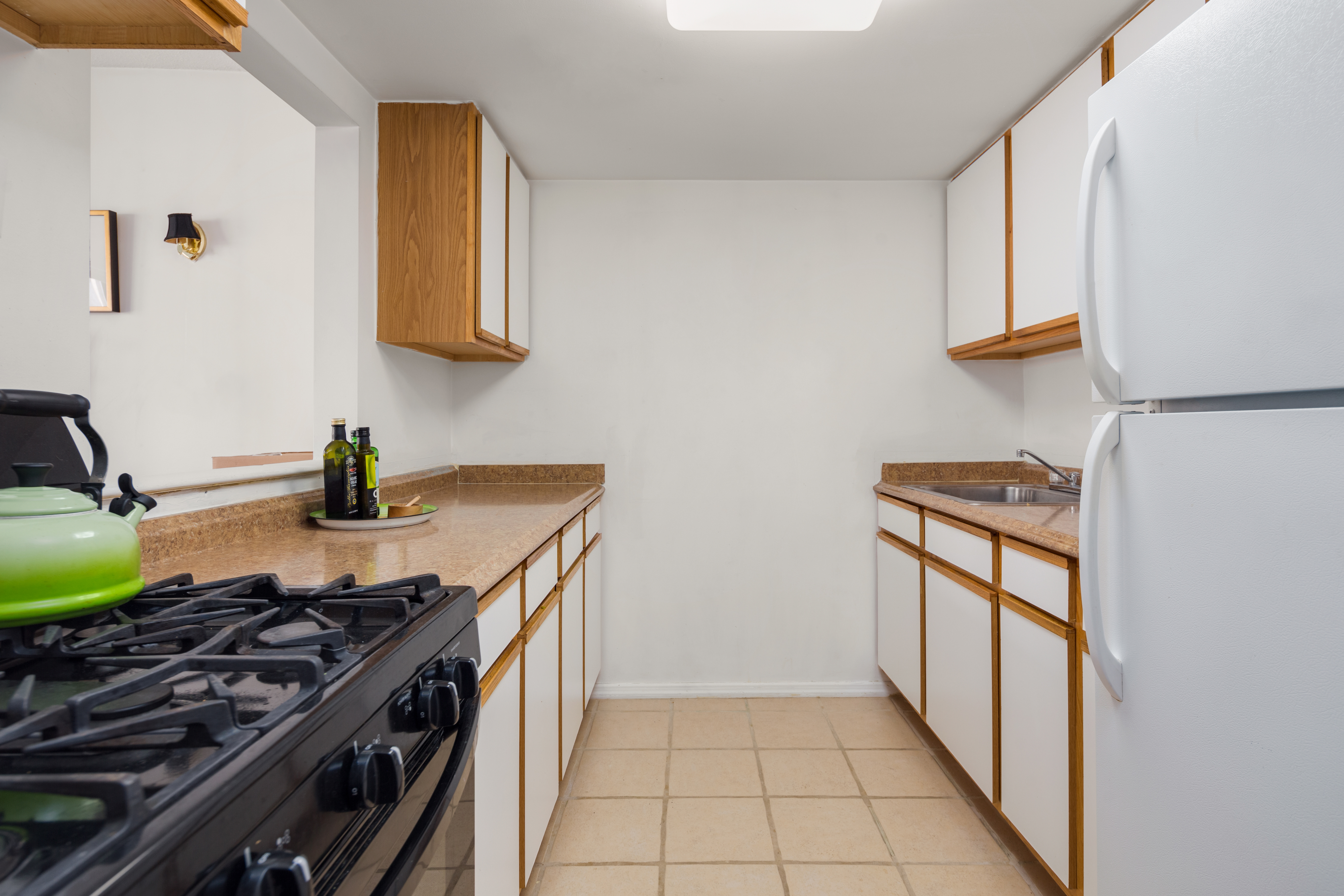 226 West 123rd Street, Unit 2 Manhattan, NY 10027 - Photo 7 of 9 a kitchen with a stove and a sink