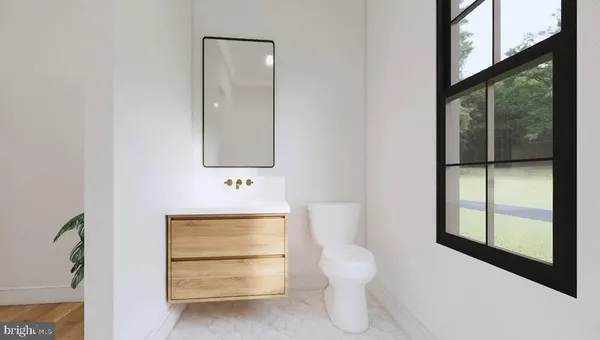 a bedroom with bed and paintings on the wall