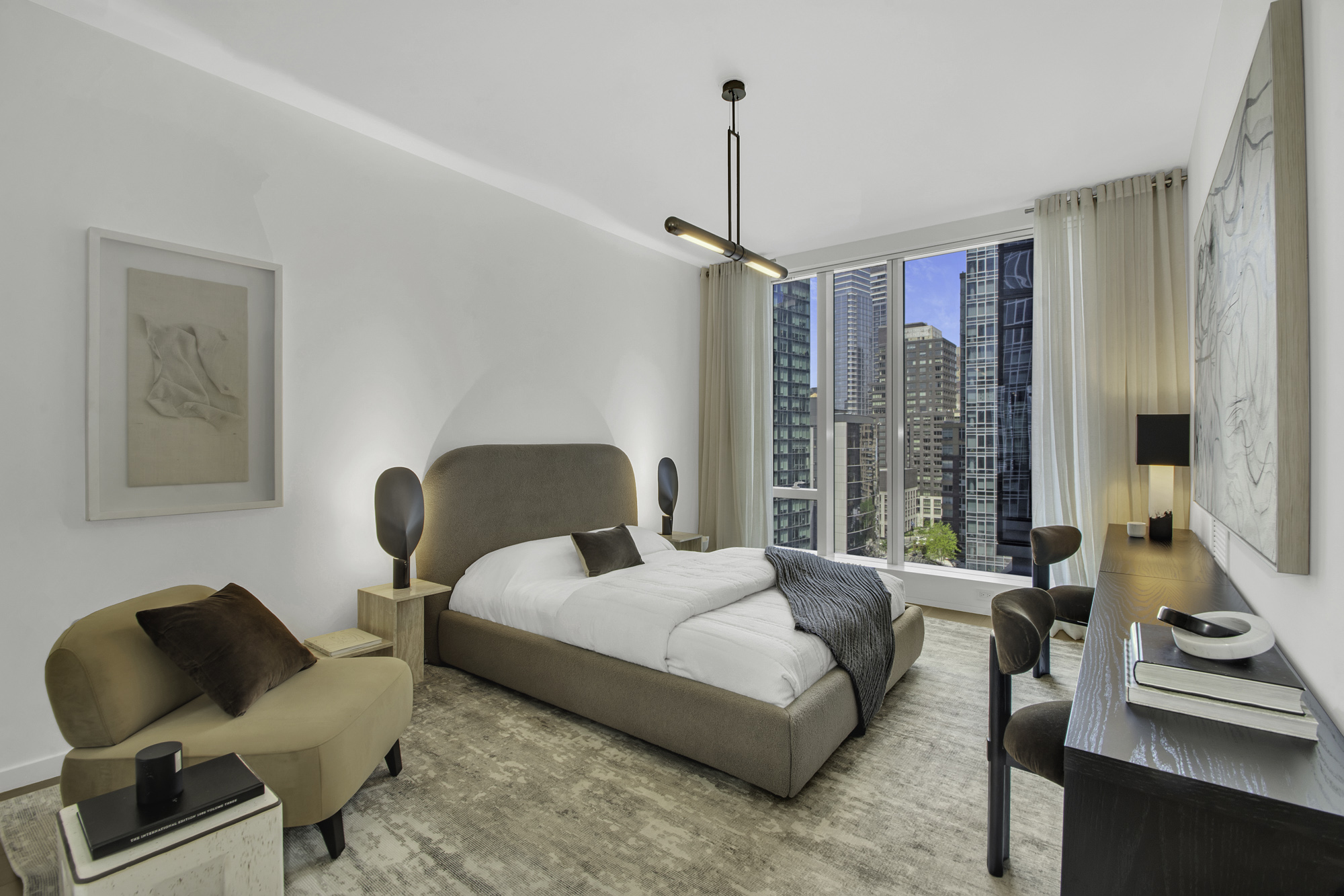 1 West End Avenue, Unit 10A Manhattan, NY 10023 - Photo 16 of 38 a bedroom with a bed and glass window