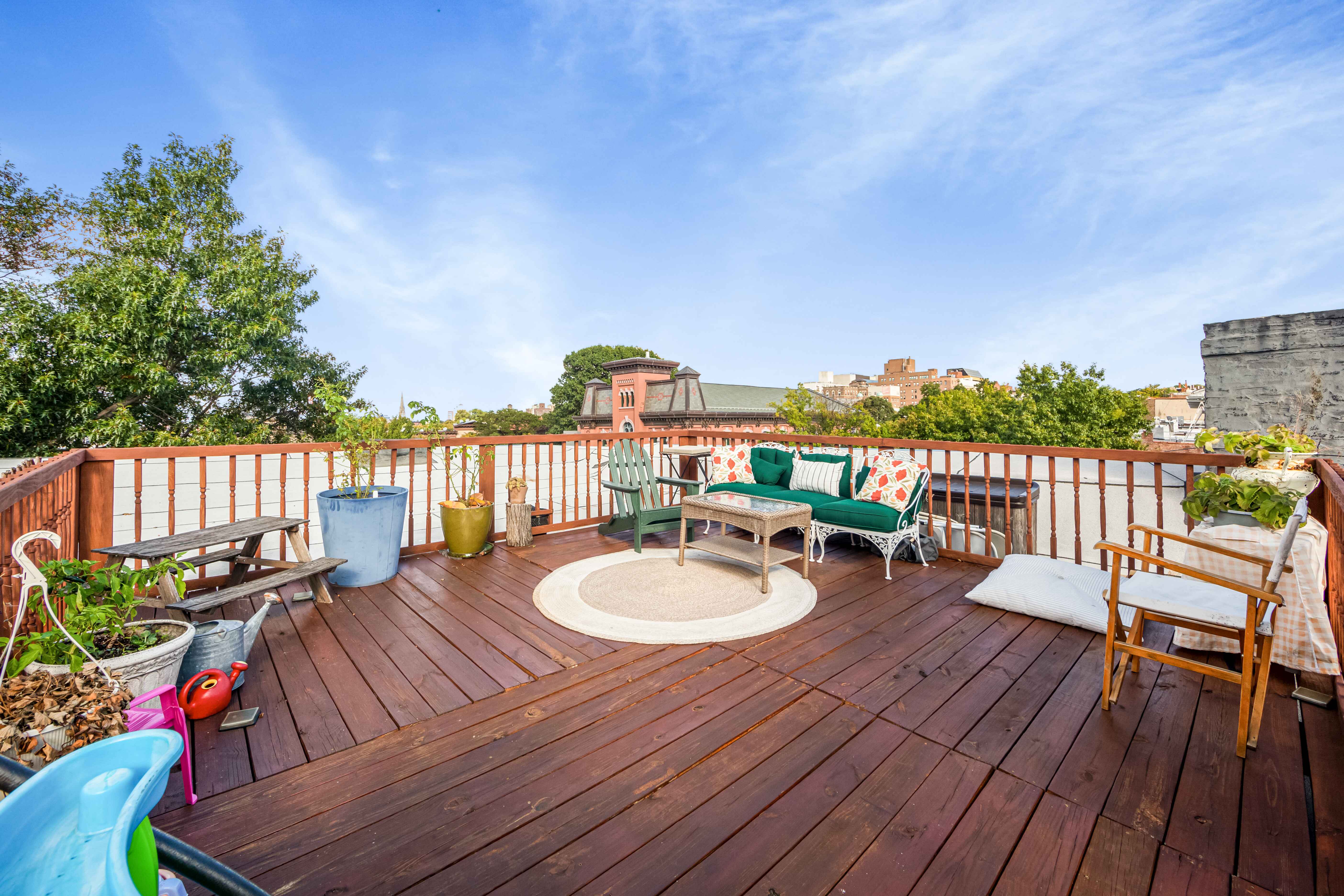 420 6th Avenue, Unit 11 Brooklyn, NY 11215 - Photo 9 of 12 a balcony with wooden floor and fence
