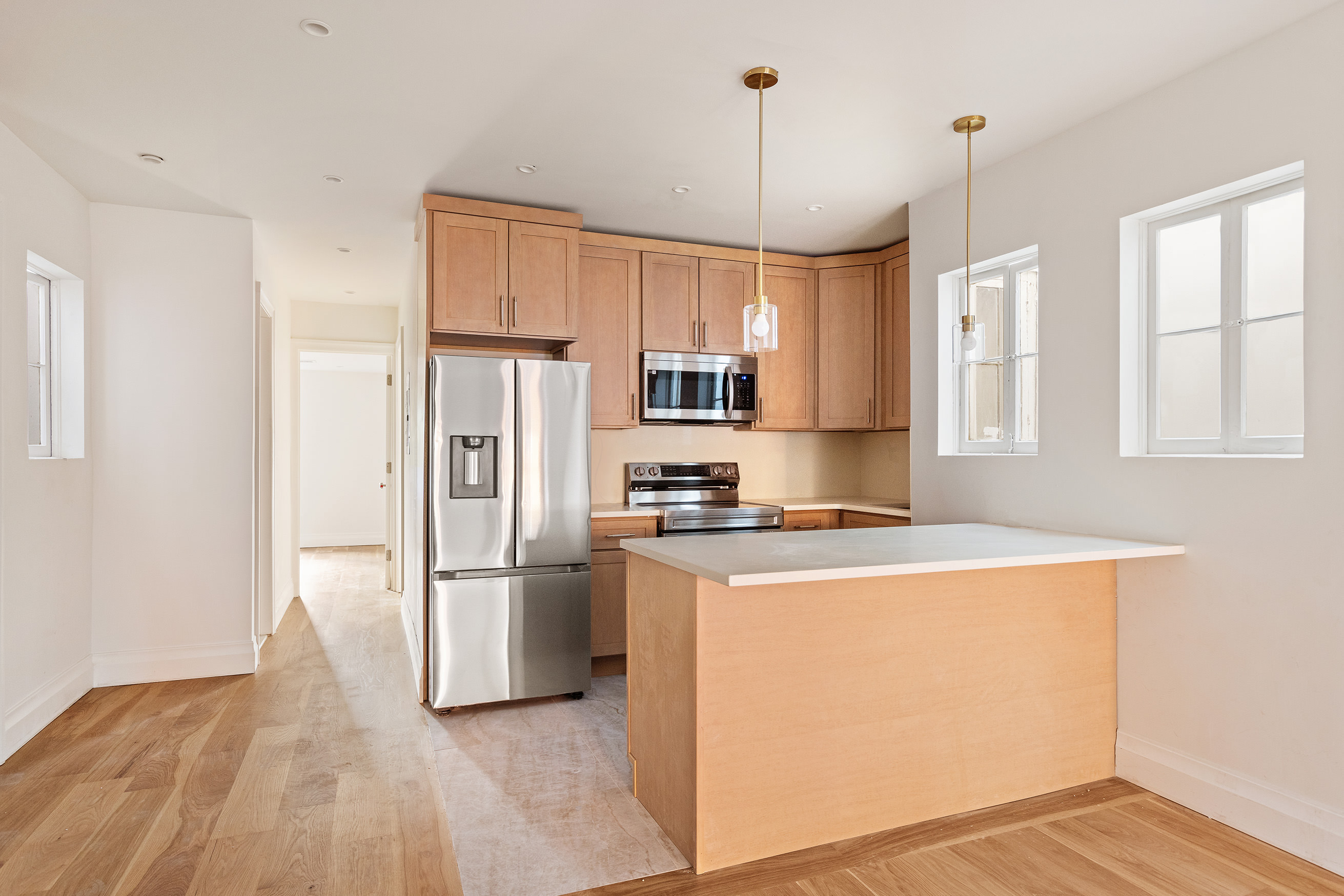 80 7th Avenue, Unit 4 Brooklyn, NY 11217 - Photo 3 of 9 a kitchen with stainless steel appliances granite countertop a refrigerator a stove a sink and a refrigerator