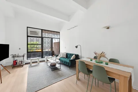 a living room with furniture and window