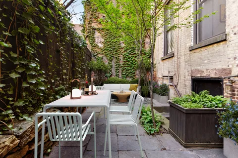 a view of a patio with a yard