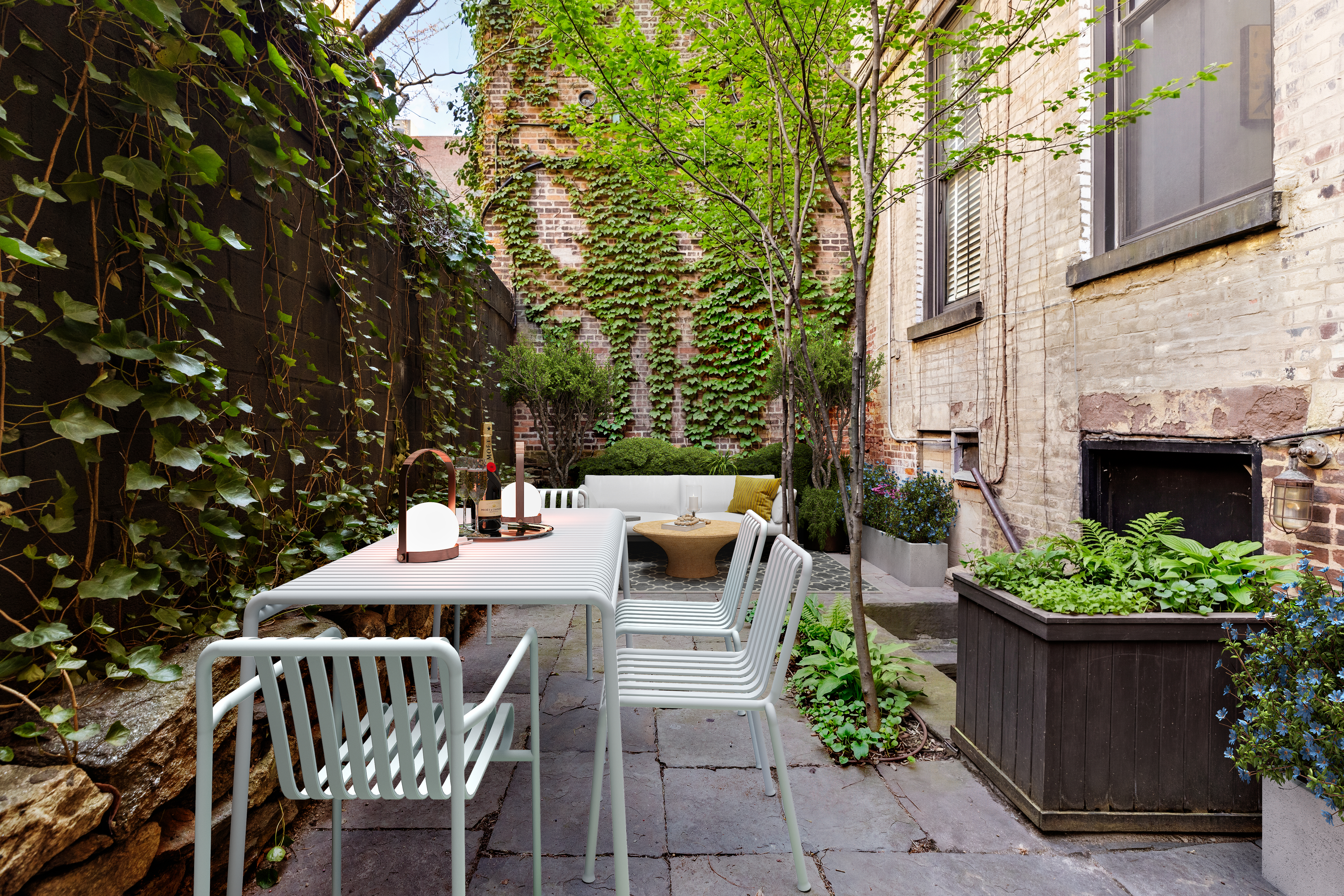 221 West 21st Street, Unit 1C Manhattan, NY 10011 - Photo 6 of 9 a view of a patio with a yard