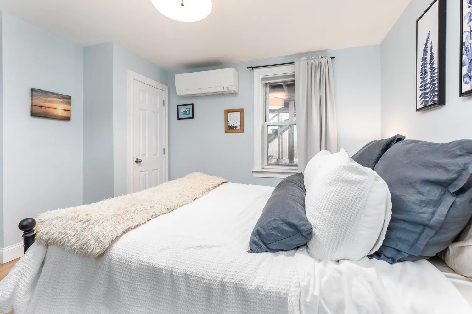 a bedroom with a bed and a couch