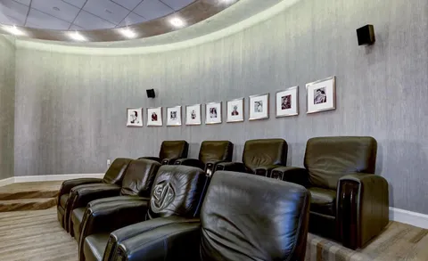 a view of a livingroom with furniture and windows
