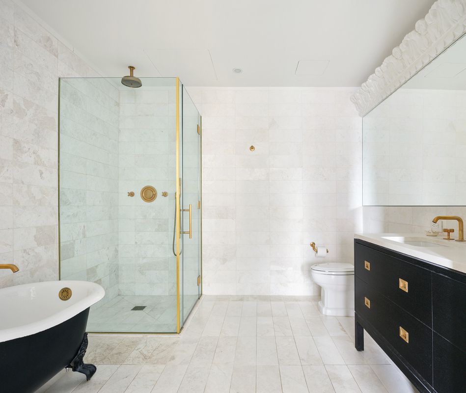 93 Worth Street, Unit 1401 Manhattan, NY 10013 - Photo 5 of 9 a spacious bathroom with a double vanity sink toilet and shower