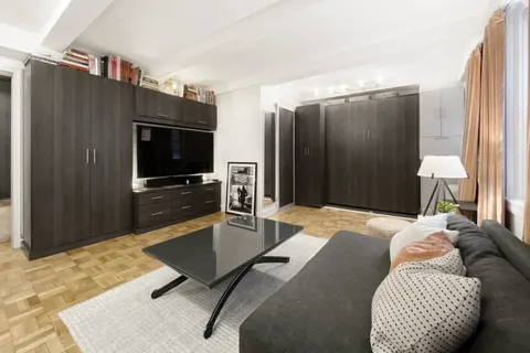 a bedroom with a bed and furniture