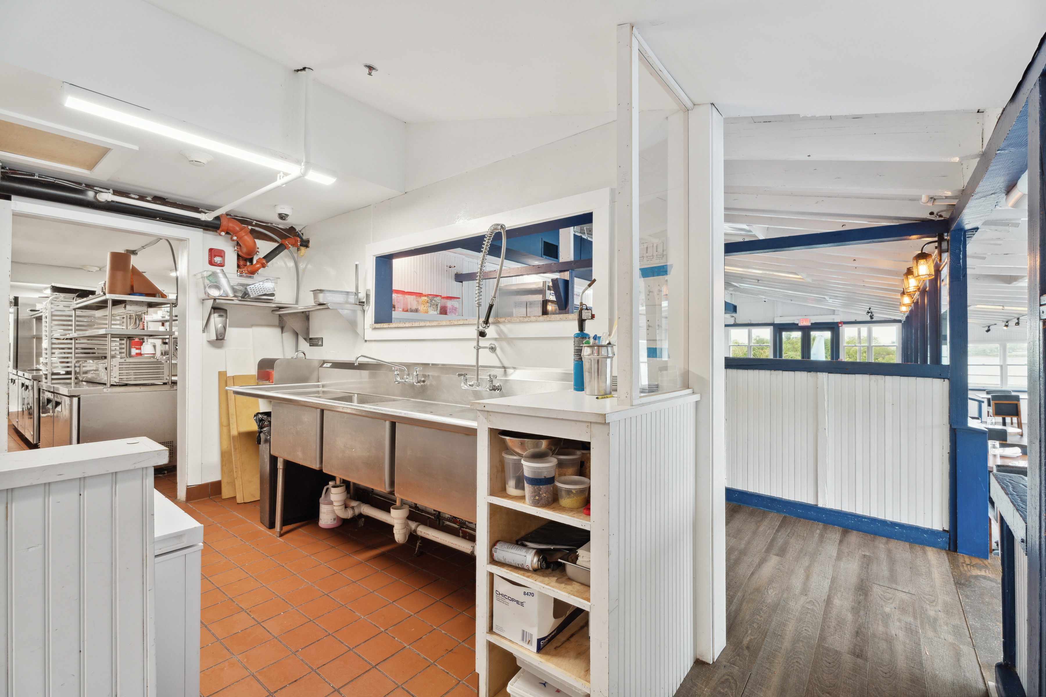 5 Inlet Road Hampton Bays, NY 11946 - Photo 16 of 20 a room with cabinets and chair