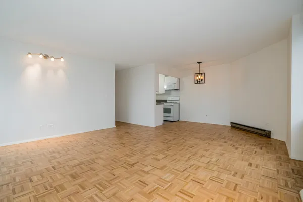 a view of empty room with a fireplace