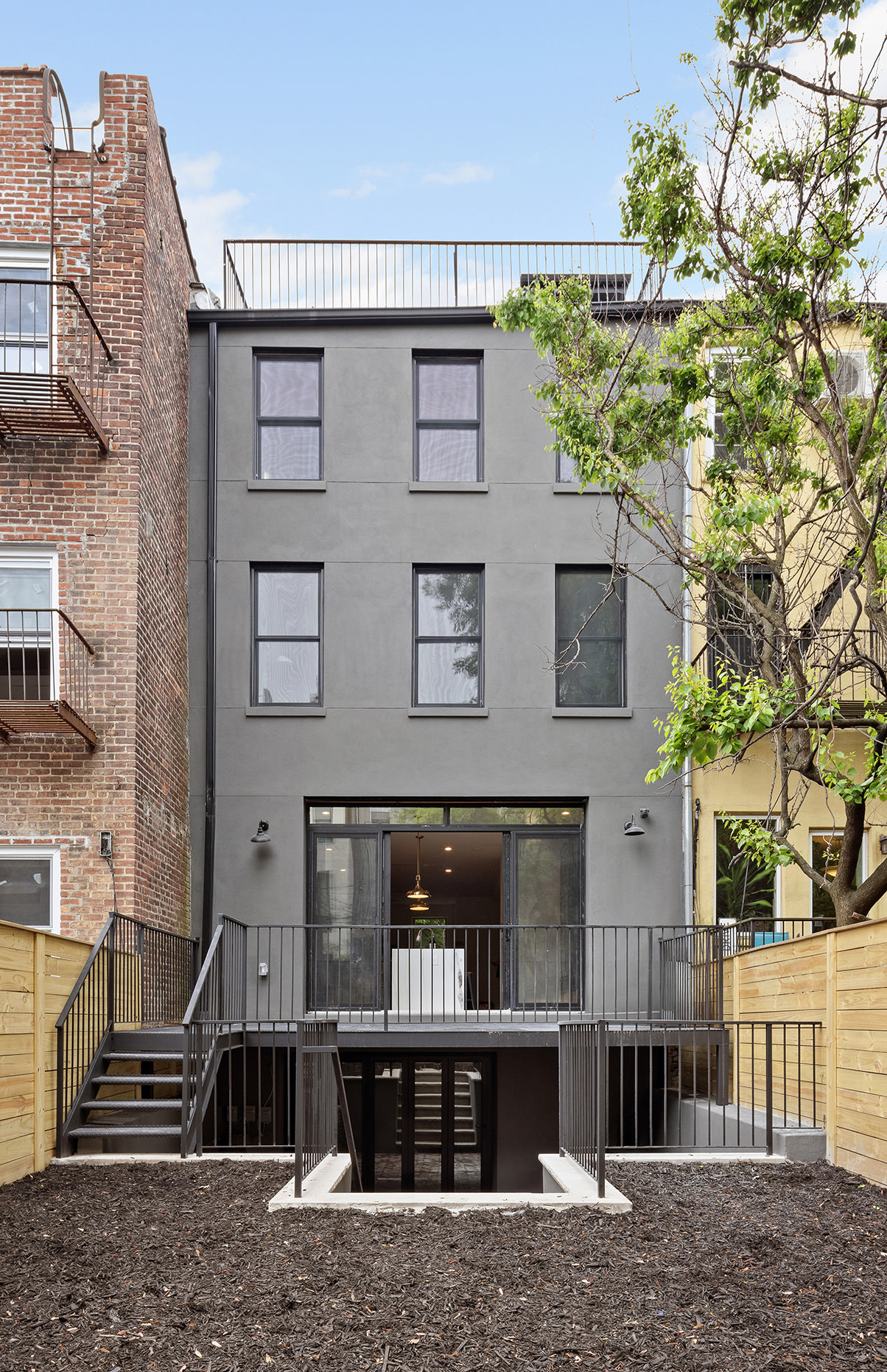 363 Warren Street Brooklyn, NY 11201 - Photo 19 of 23 a front view of a house with garden