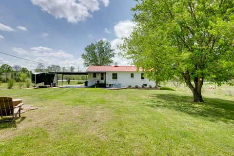 a view of a trees and barn