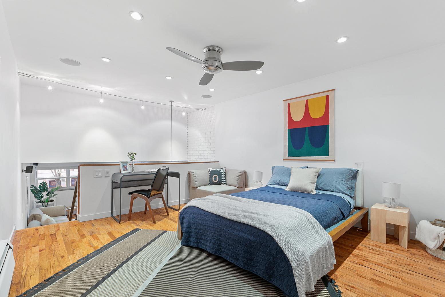 49 East 12th Street, Unit 2C Manhattan, NY 10003 - Photo 7 of 9 a bedroom with a bed and a table