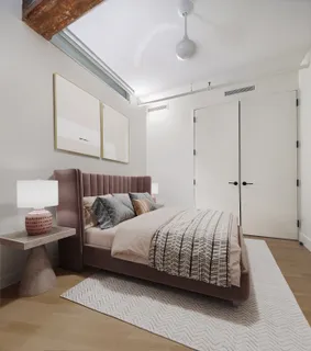 a bedroom with bed and a night stand