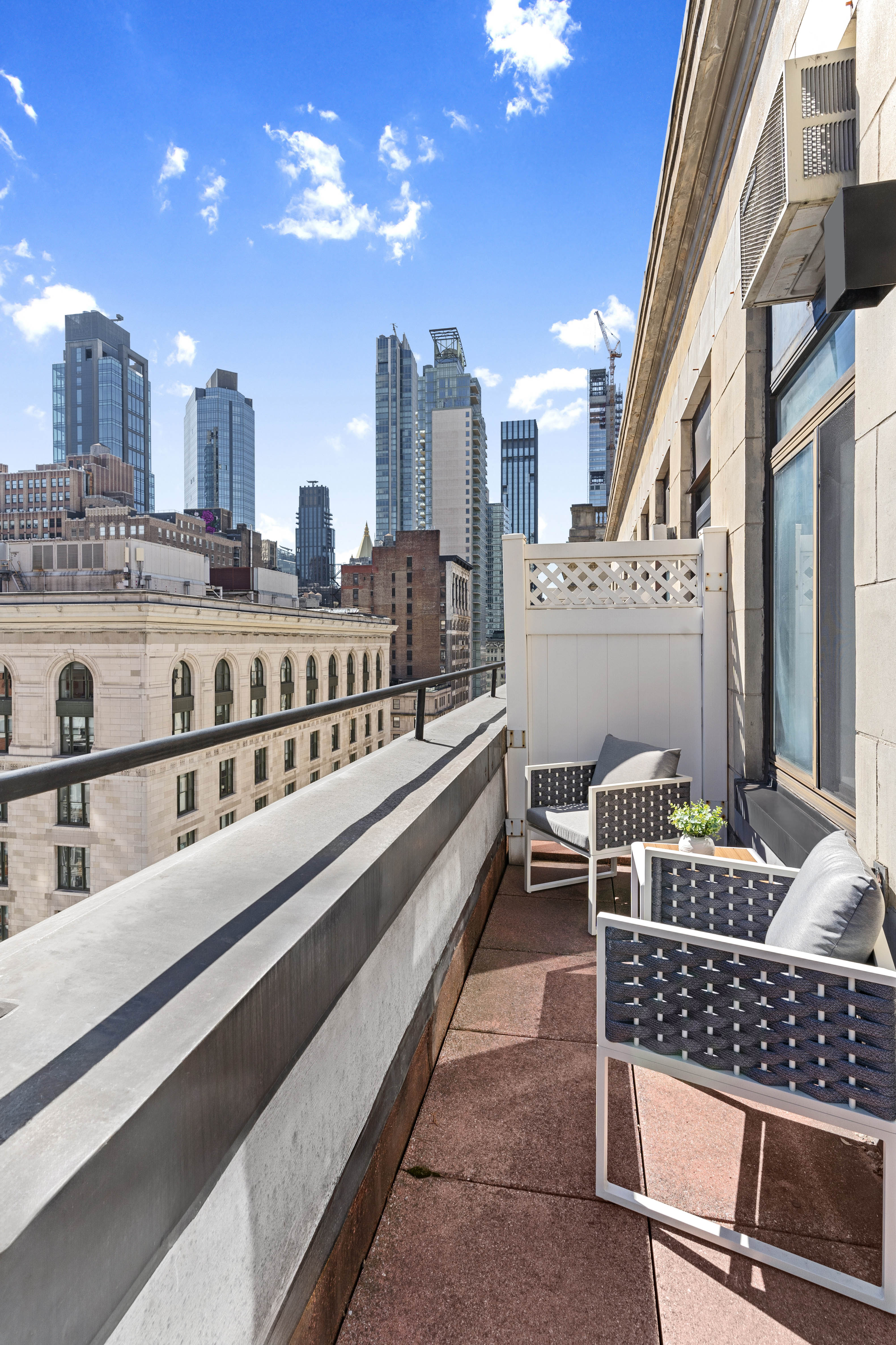 372 5th Avenue, Unit 9J Manhattan, NY 10018 - Photo 9 of 13 a balcony with city view