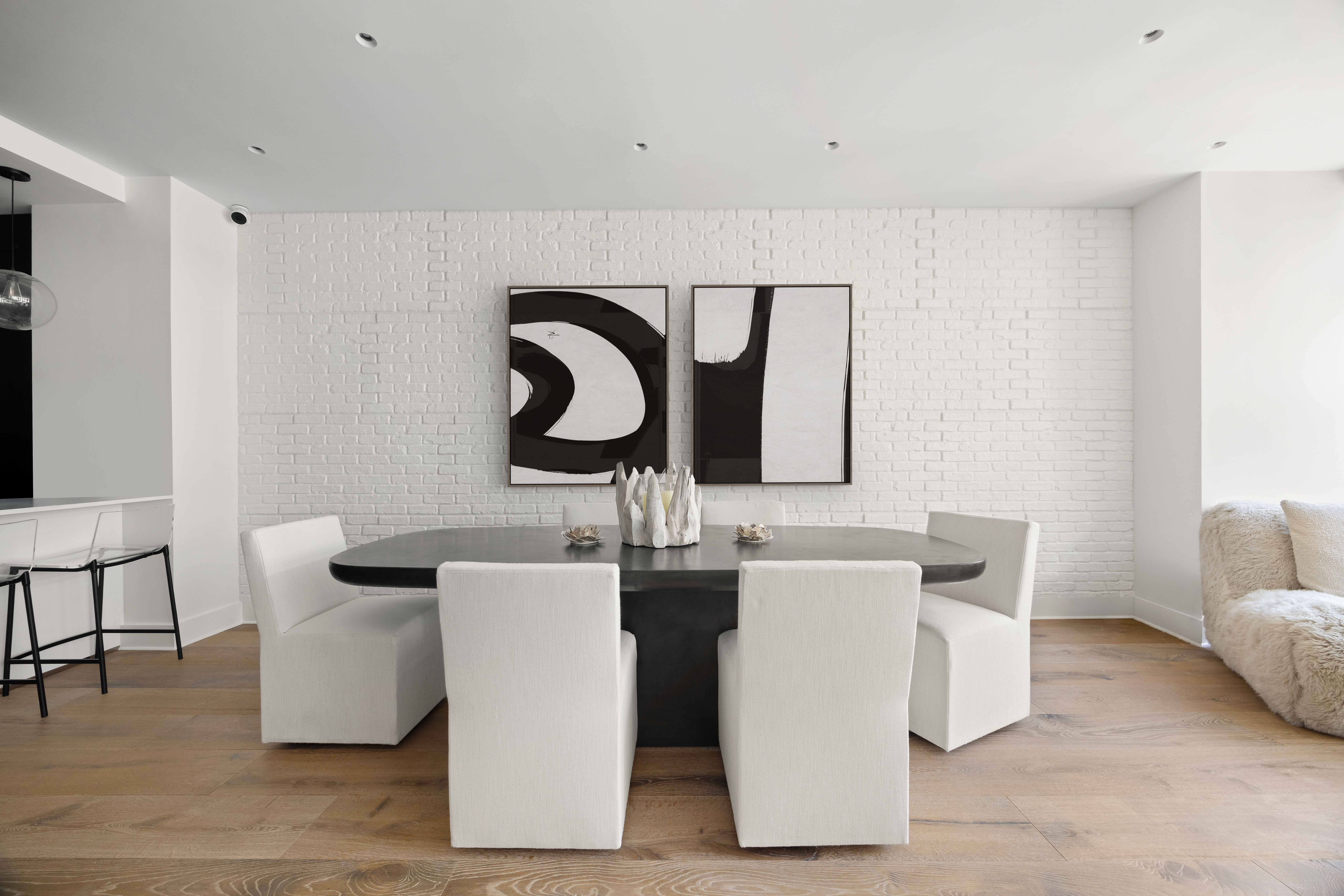 128 West 26th Street, Unit PH Manhattan, NY 10001 - Photo 5 of 21 a dining room with couches and large mirror with wooden floor