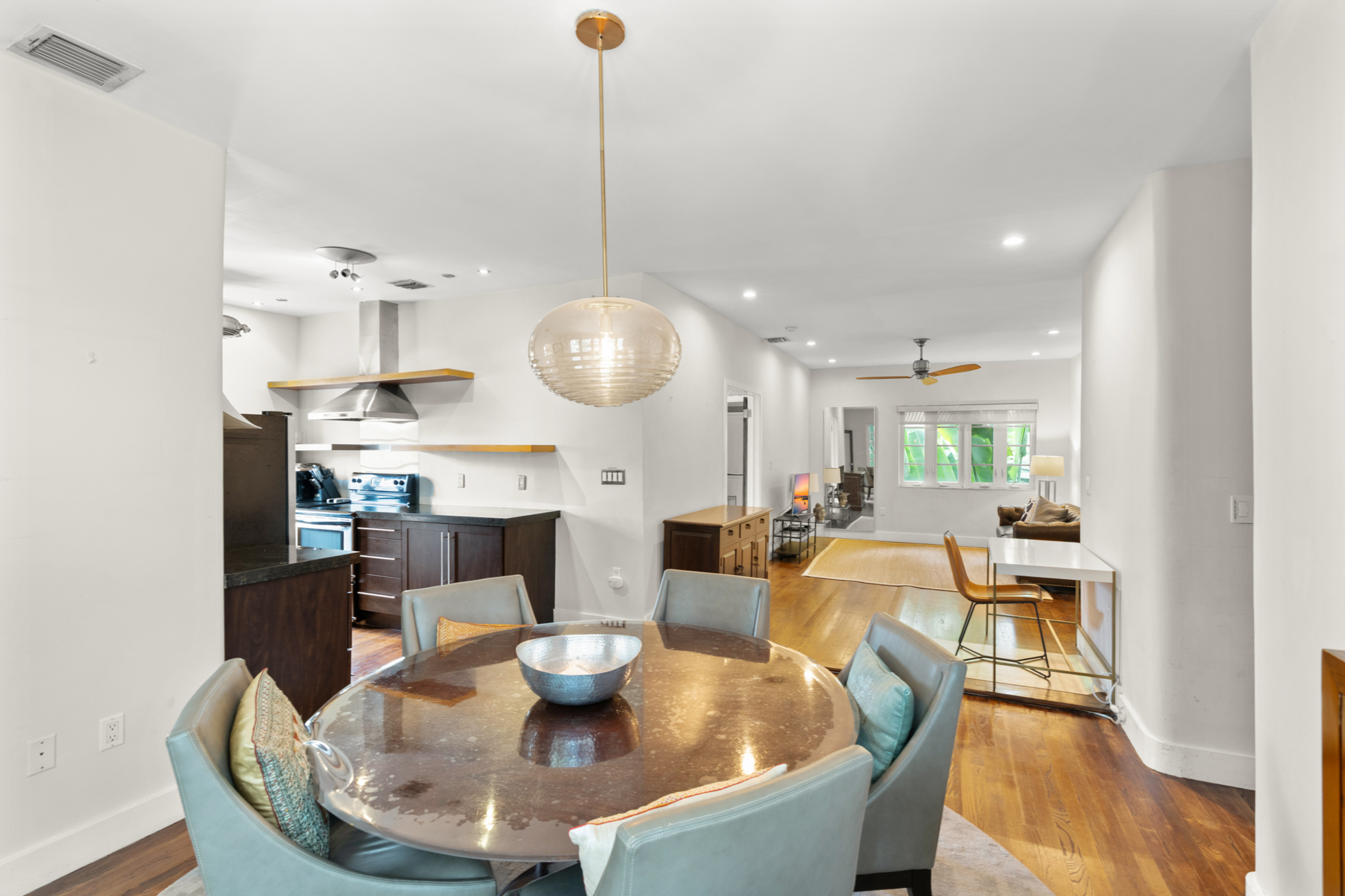 711 East 14th Street, Unit 7 Hialeah, FL 33010 - Photo 10 of 36 a living room with fireplace furniture and a wooden floor