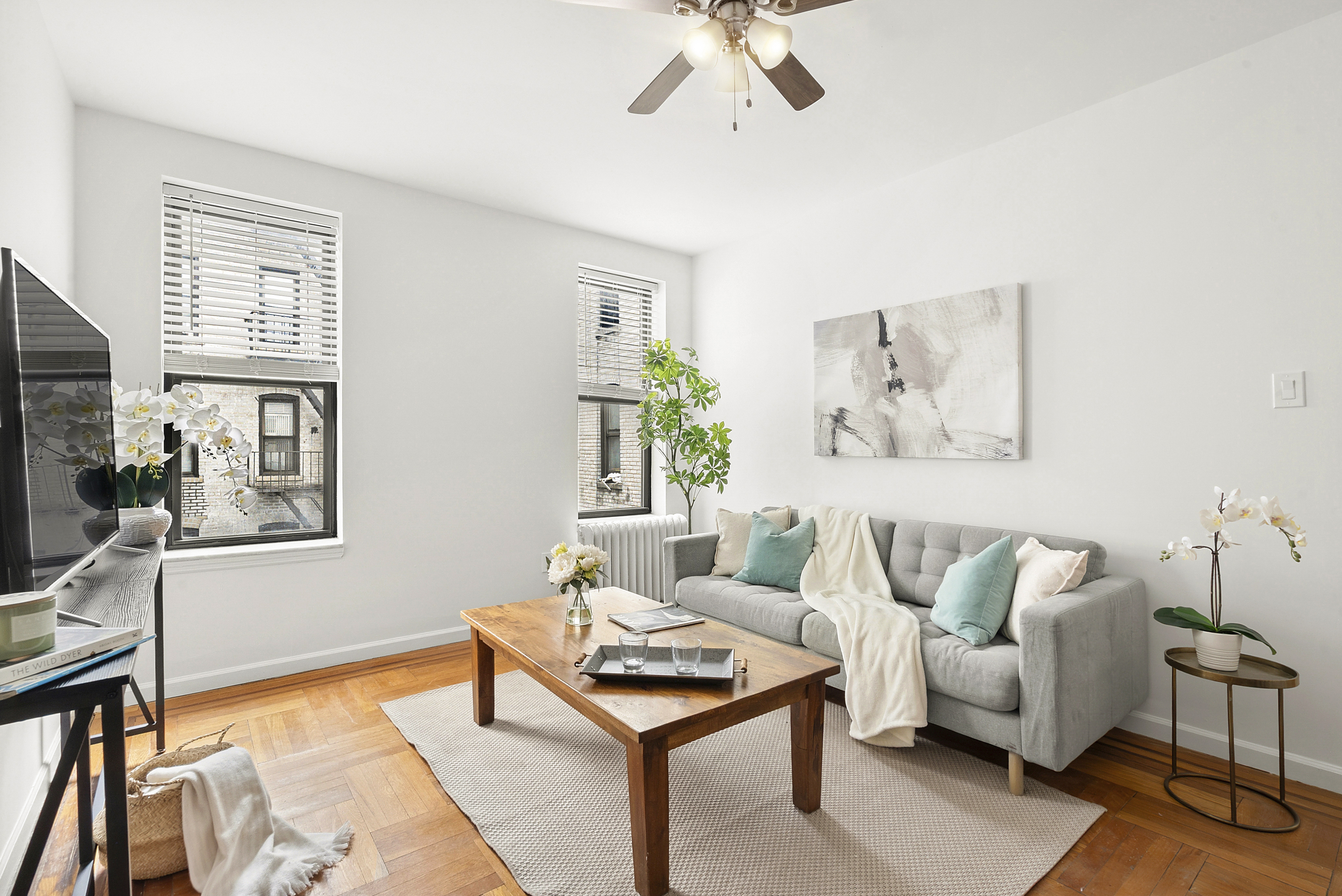 325 Marine Avenue, Unit D10 Brooklyn, NY 11209 - Photo 1 of 5 a living room with furniture and a flat screen tv