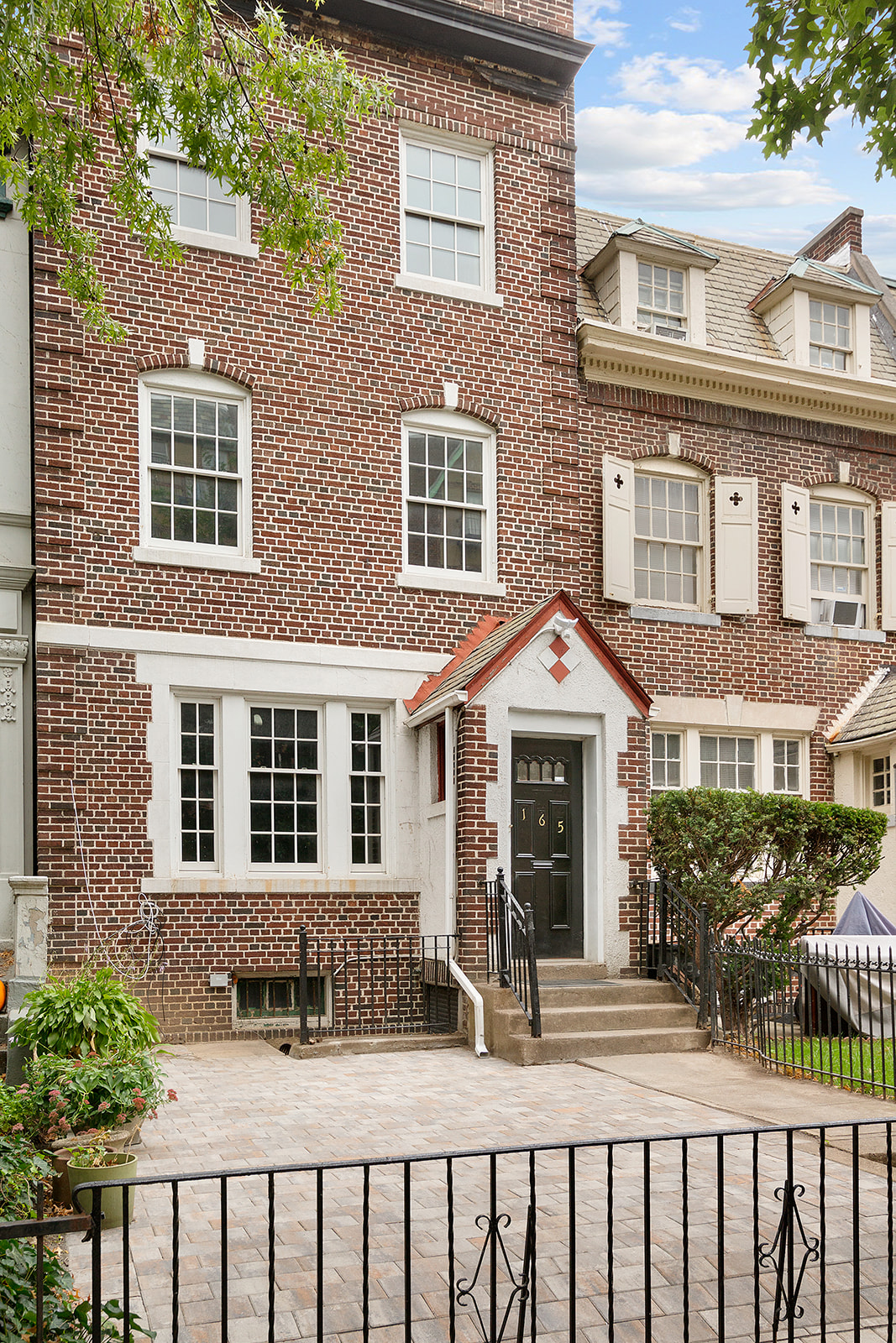 165 Fenimore Street Brooklyn, NY 11225 - Photo 12 of 13 a front view of a brick house with large windows