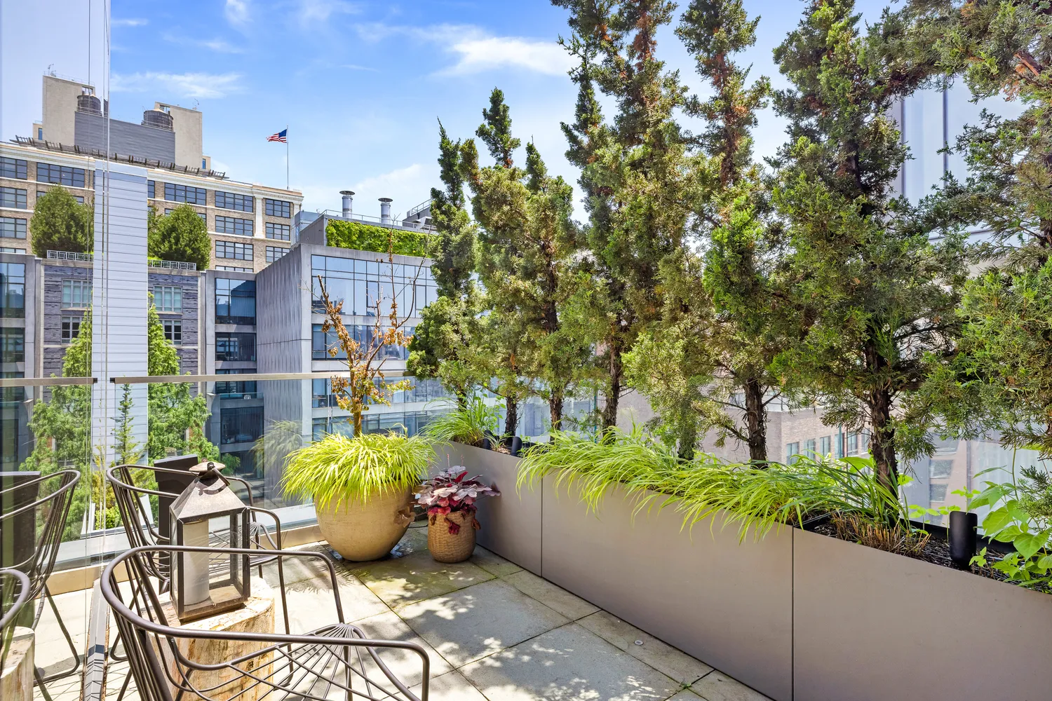a view of a patio with table and chairs and potted plants