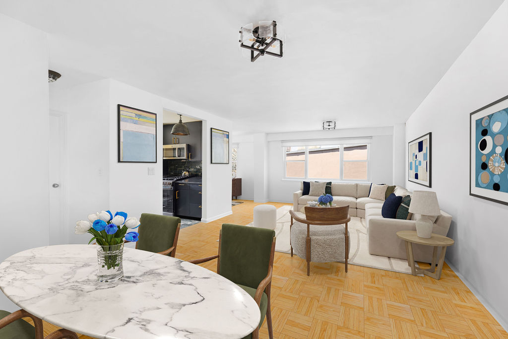 101 West 12th Street, Unit 5V Manhattan, NY 10011 - Photo 1 of 26 a living room with furniture potted plant and open kitchen view