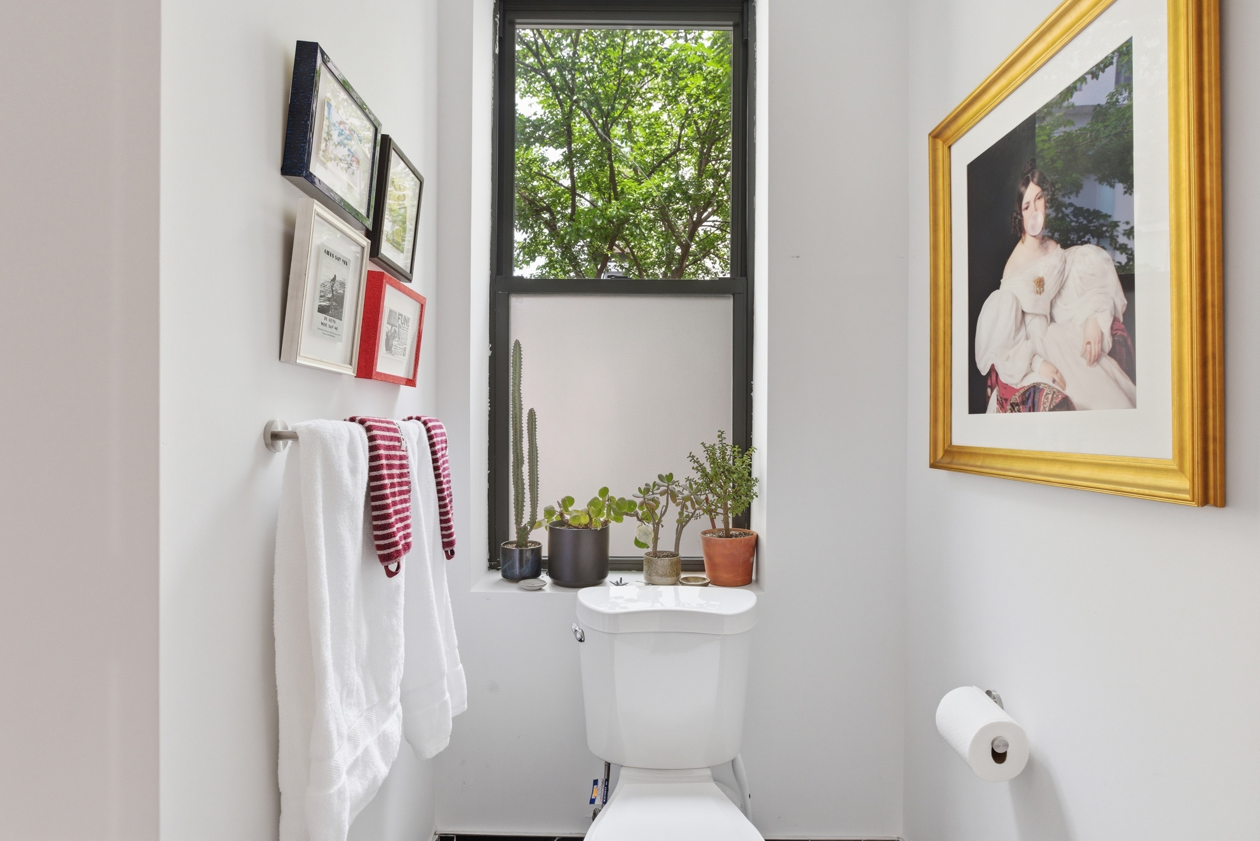 29 Greenpoint Avenue Brooklyn, NY 11222 - Photo 14 of 18 a bathroom with a toilet and a painting on the wall