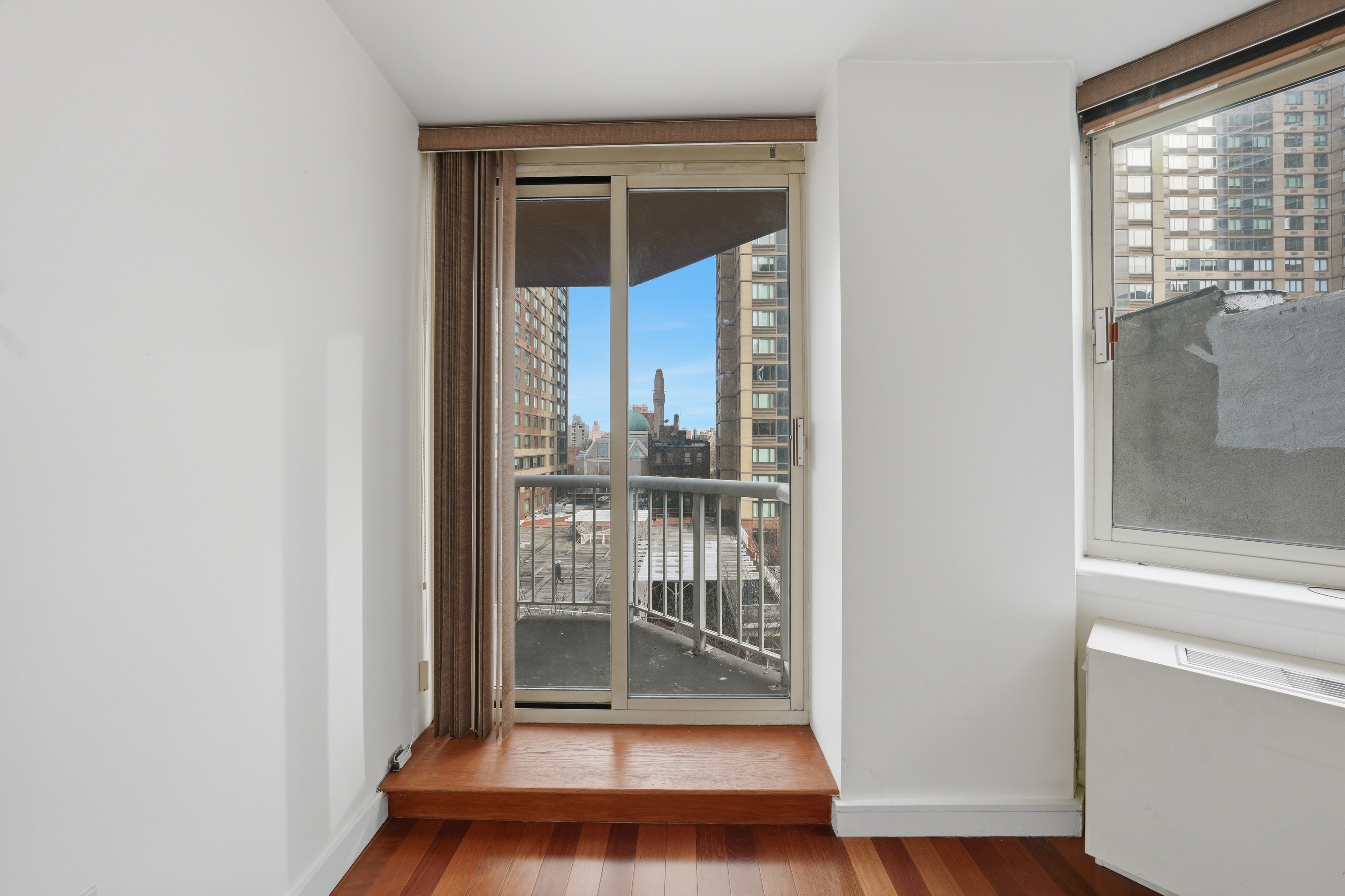 206 East 95th Street, Unit 6B Manhattan, NY 10128 - Photo 13 of 25 a view of a bathroom with a glass door