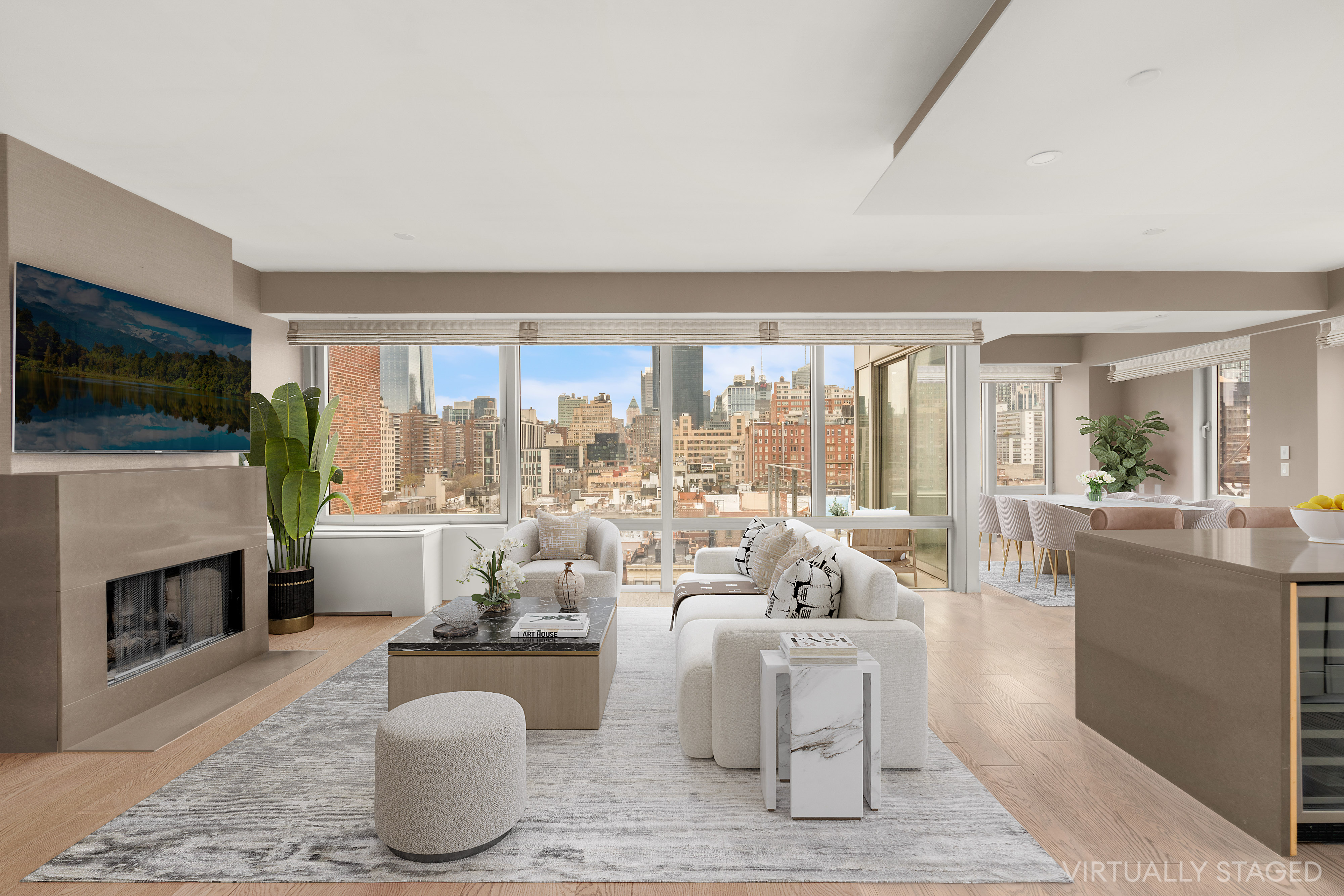 245 West 19th Street, Unit PH4 Manhattan, NY 10011 - Photo 2 of 13 a living room with furniture a flat screen tv and a fireplace