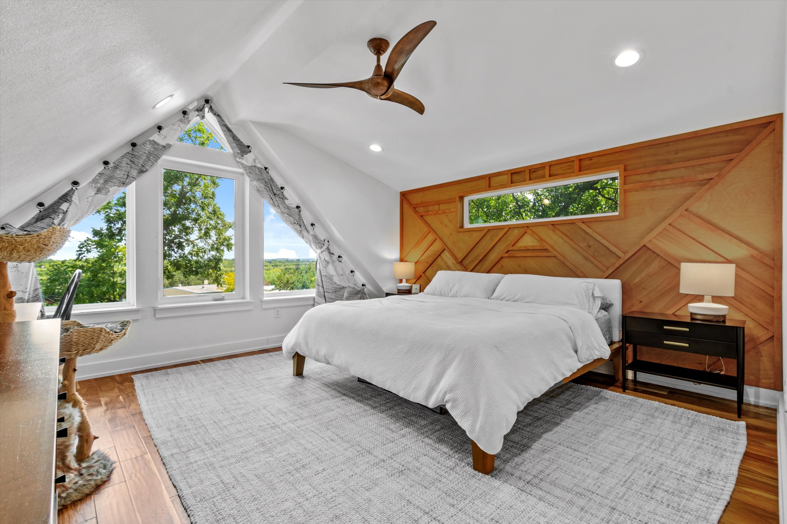 2712 Oak Springs Drive, Unit A Austin, TX 78702 - Photo 5 of 38 a bed room with a bed and a large window