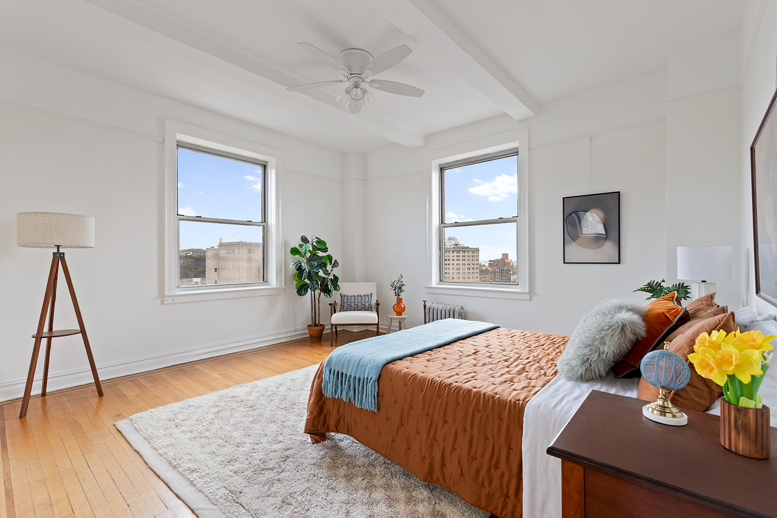 41 Eastern Parkway, Unit 8B Brooklyn, NY 11238 - Photo 7 of 13 a bedroom with a bed and wooden floor
