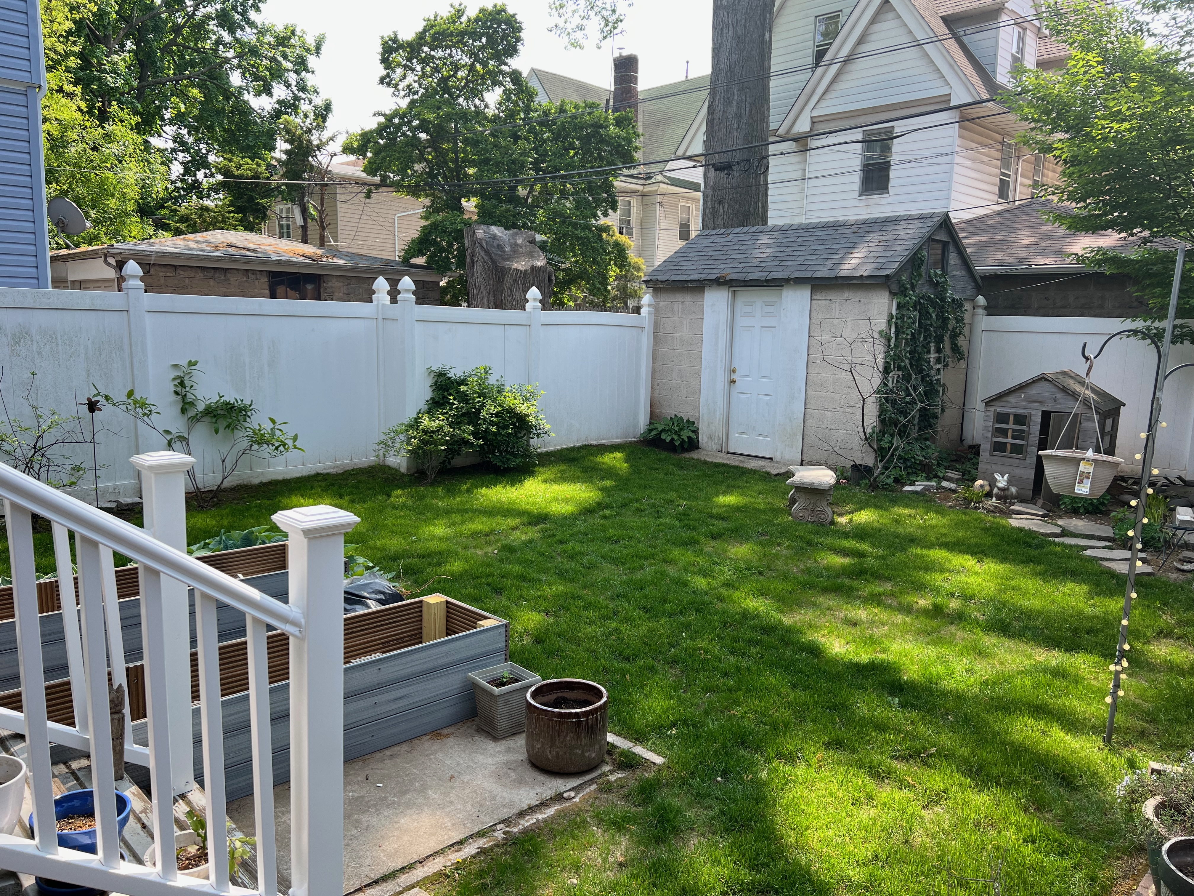 630 East 24th Street Brooklyn, NY 11210 - Photo 26 of 28 a view of a chair and table in the backyard of the house