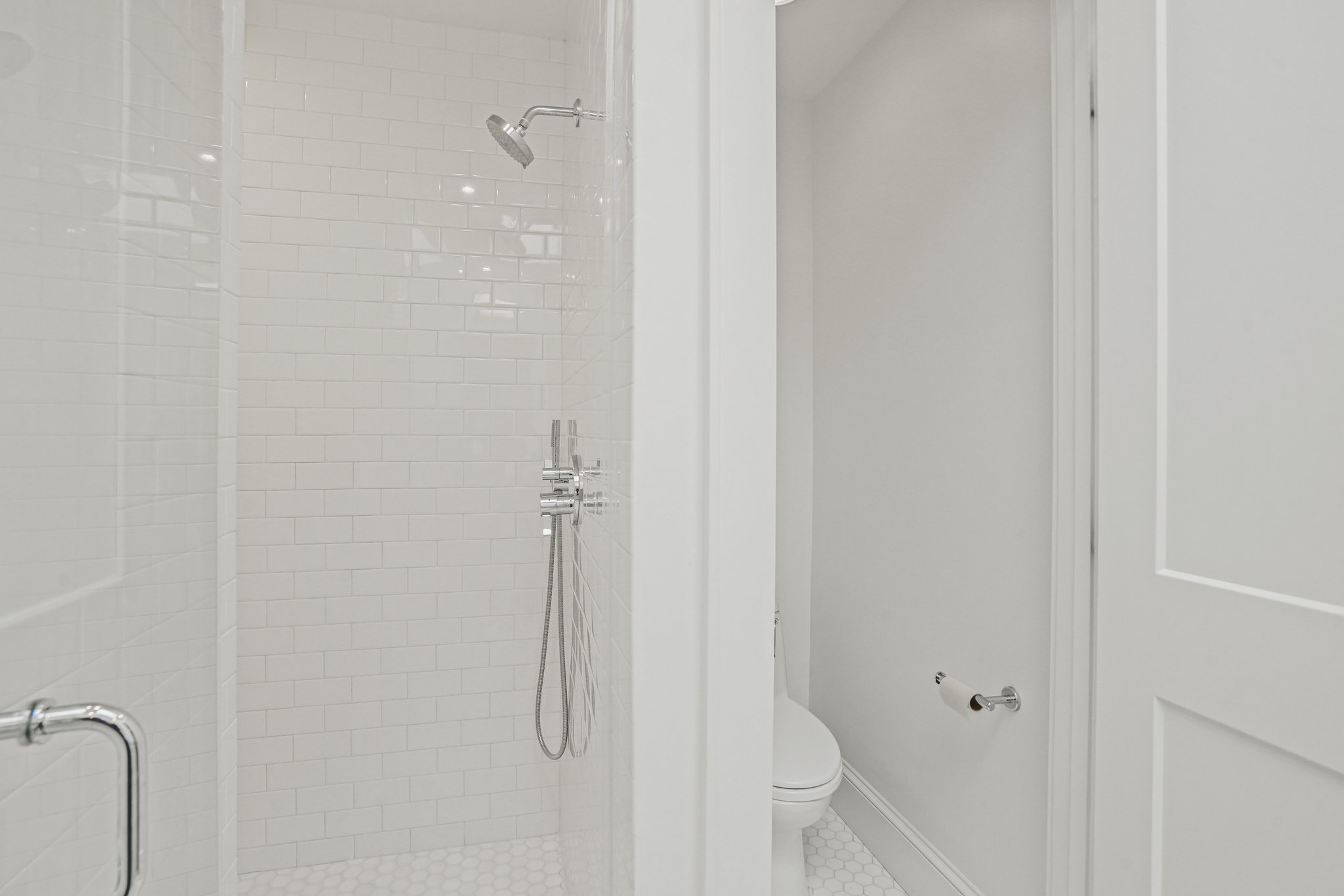 1920 35th Street Northwest Washington, DC 20007 - Photo 21 of 54 a bathroom with a glass shower door