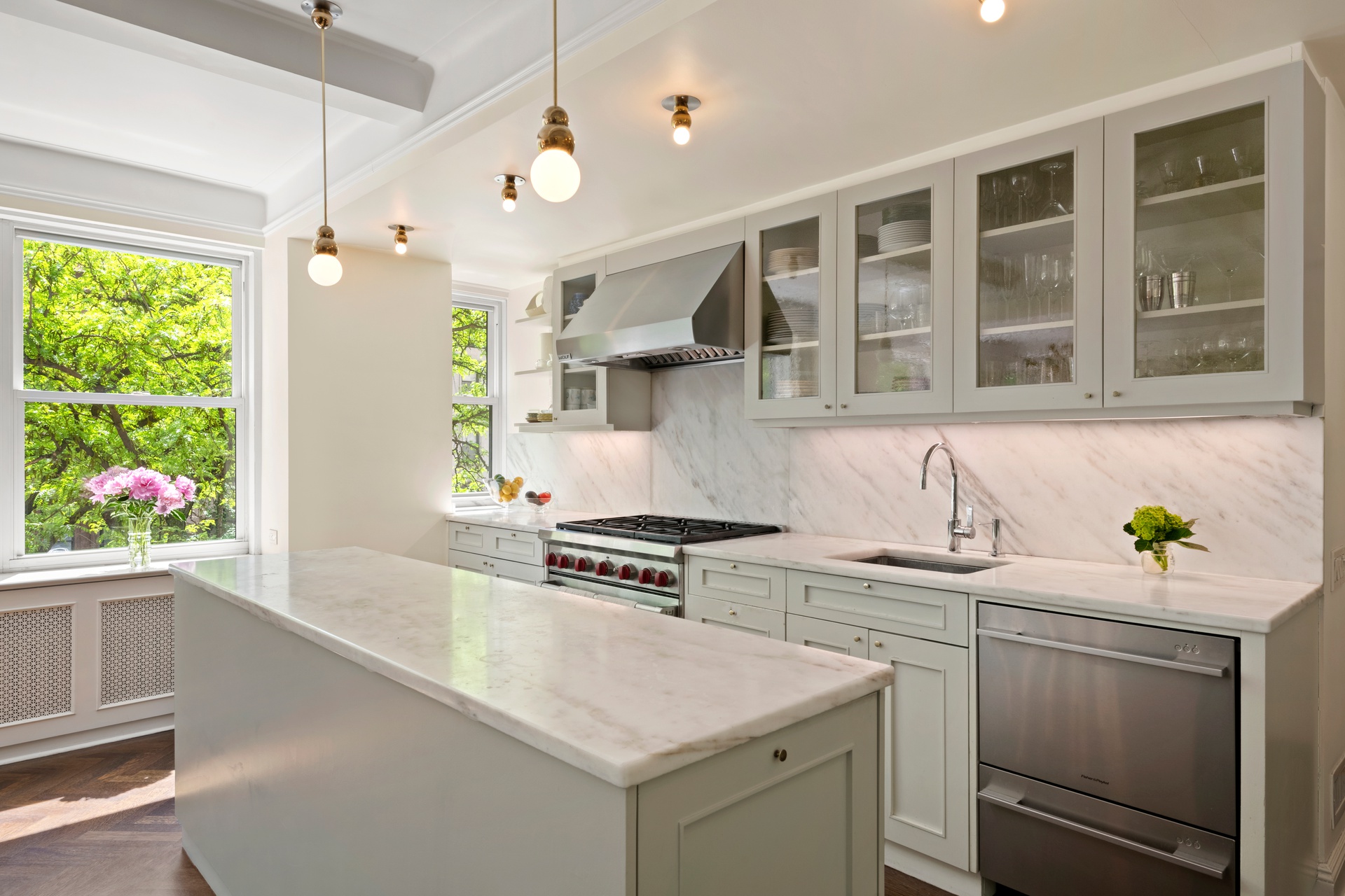 225 East 79th Street, Unit 3A Manhattan, NY 10075 - Photo 3 of 10 a kitchen with a sink stove and window