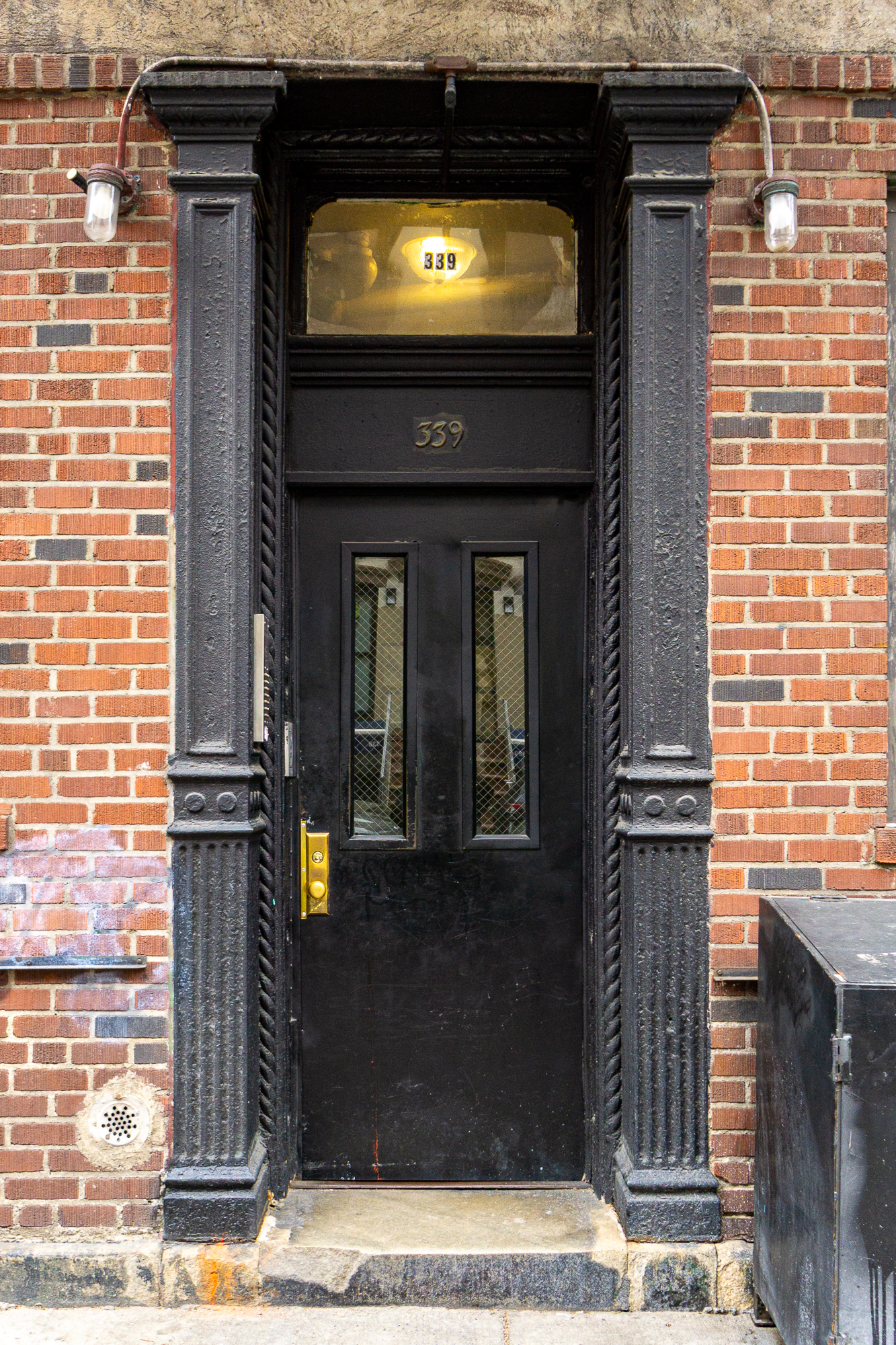 339 East 6th Street, Unit B Manhattan, NY 10003 - Photo 18 of 22 a front view of a house with a garden