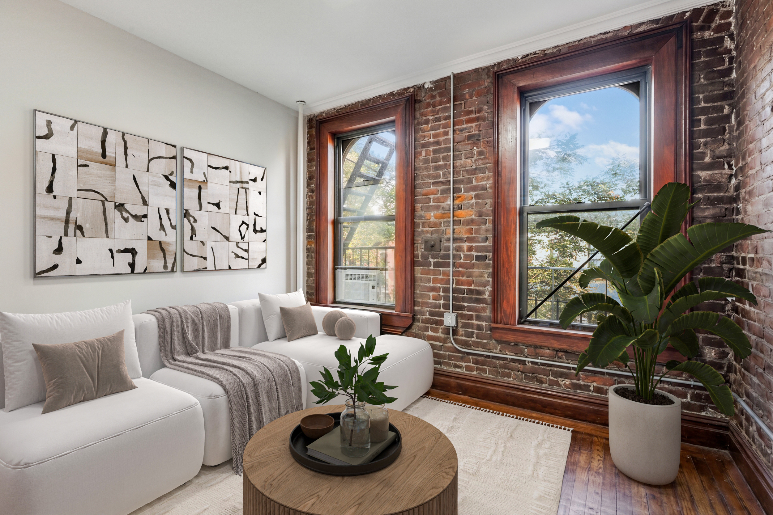 336 East 5th Street, Unit 6FE Manhattan, NY 10003 - Photo 1 of 4 a living room with furniture and a potted plant