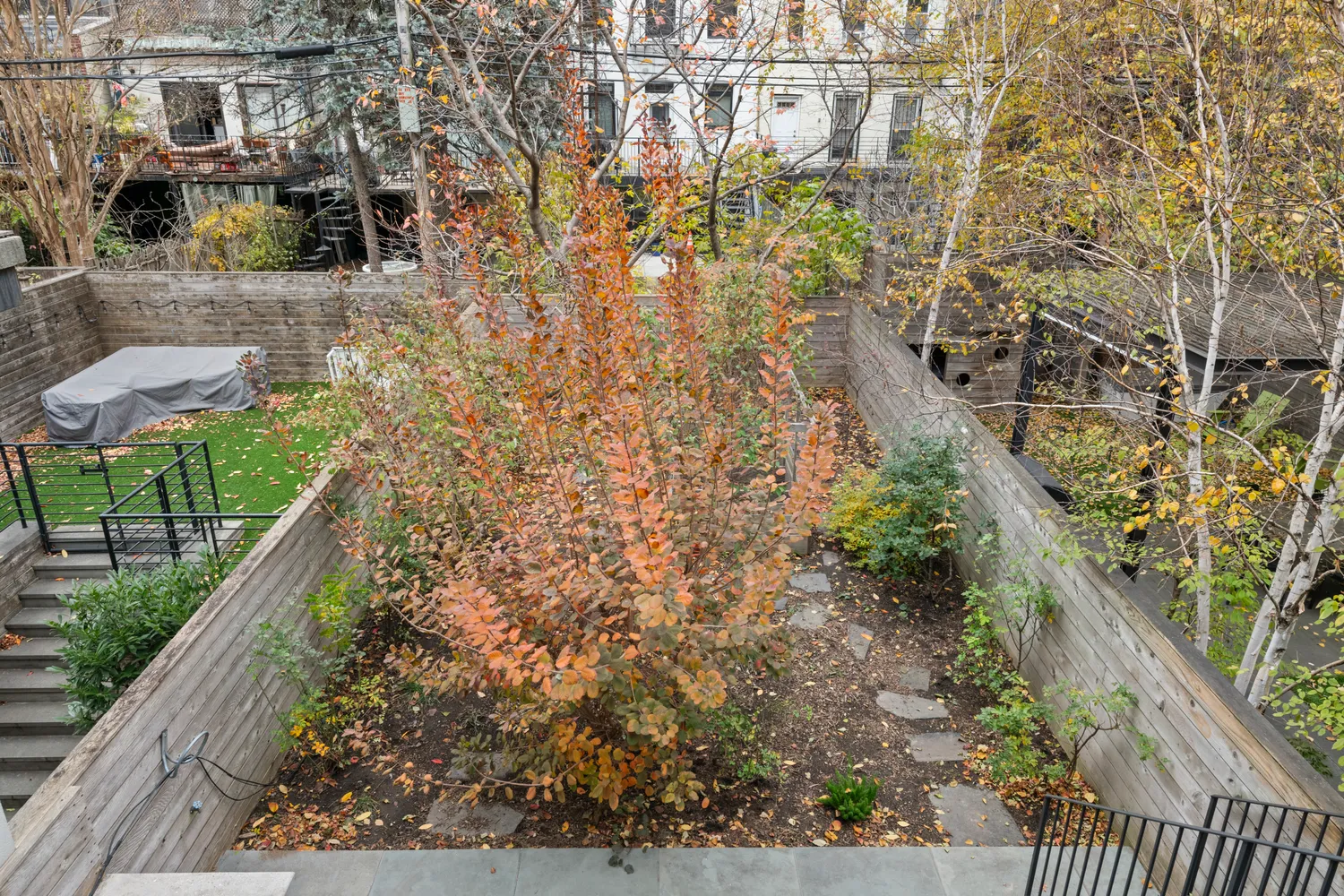 a balcony with table and chairs