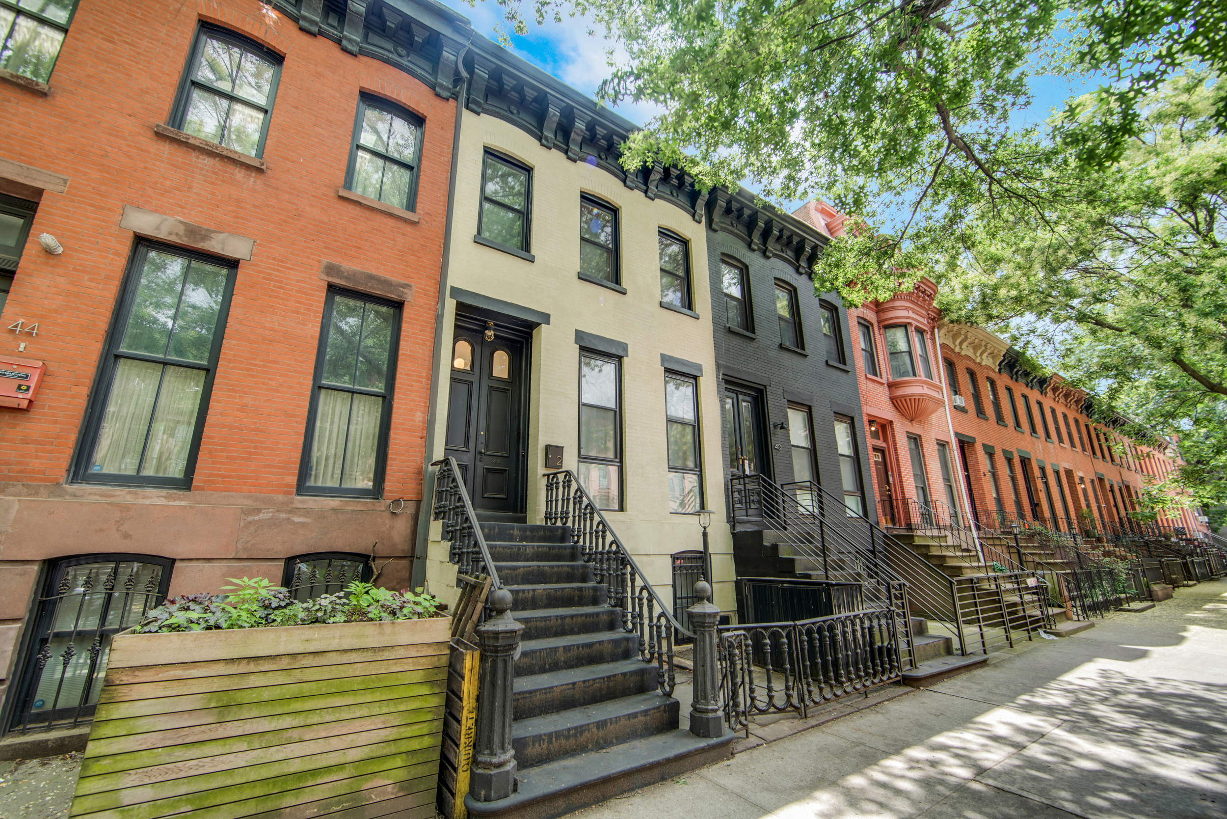 42 Monroe Street, Unit 2 Brooklyn, NY 11238 - Photo 1 of 19 a front view of a building with glass windows