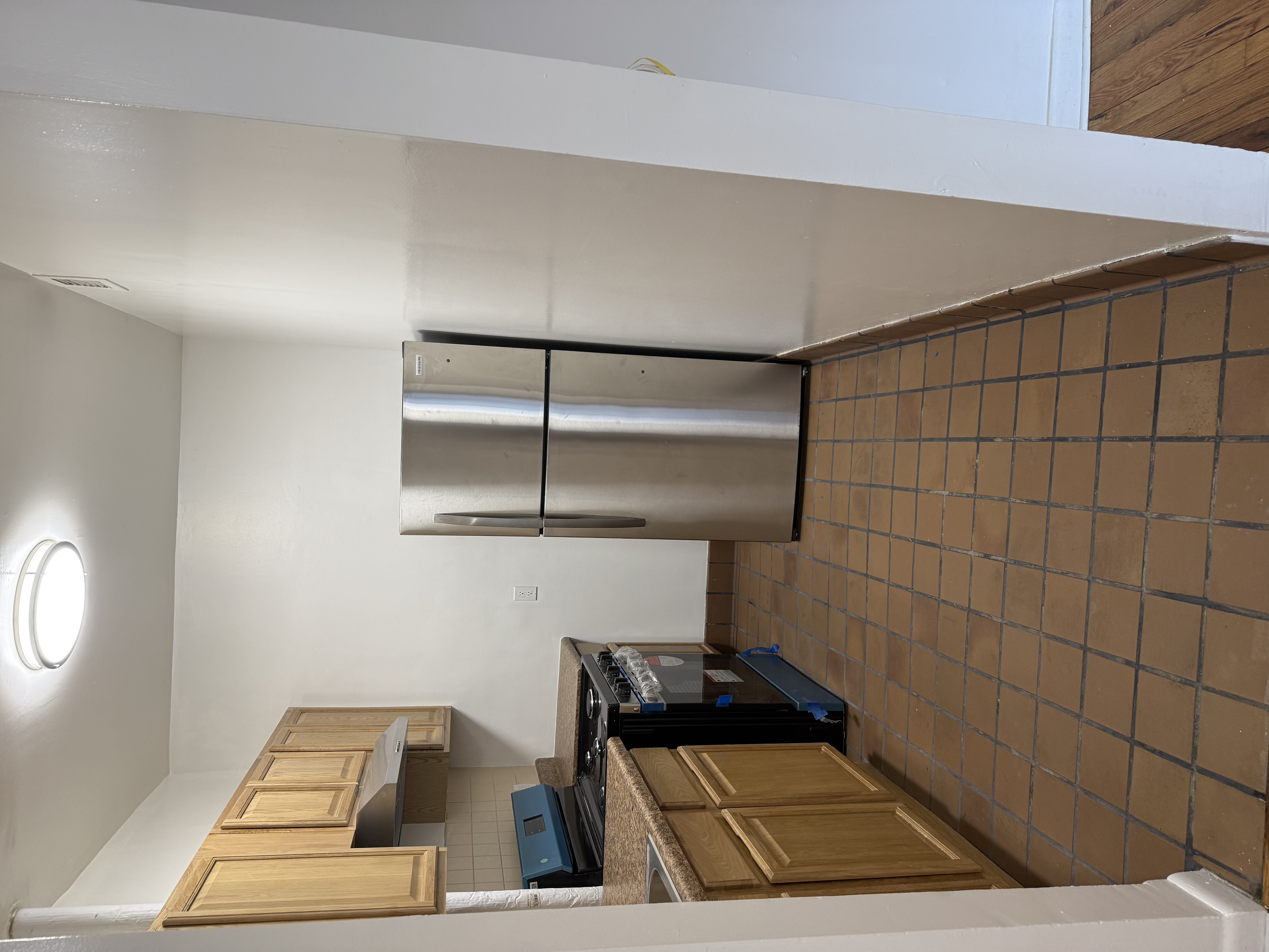 80 St Nicholas Avenue, Unit 1C Manhattan, NY 10026 - Photo 4 of 8 a kitchen with a stove a refrigerator and a sink
