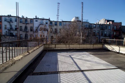 a view of a terrace with chairs
