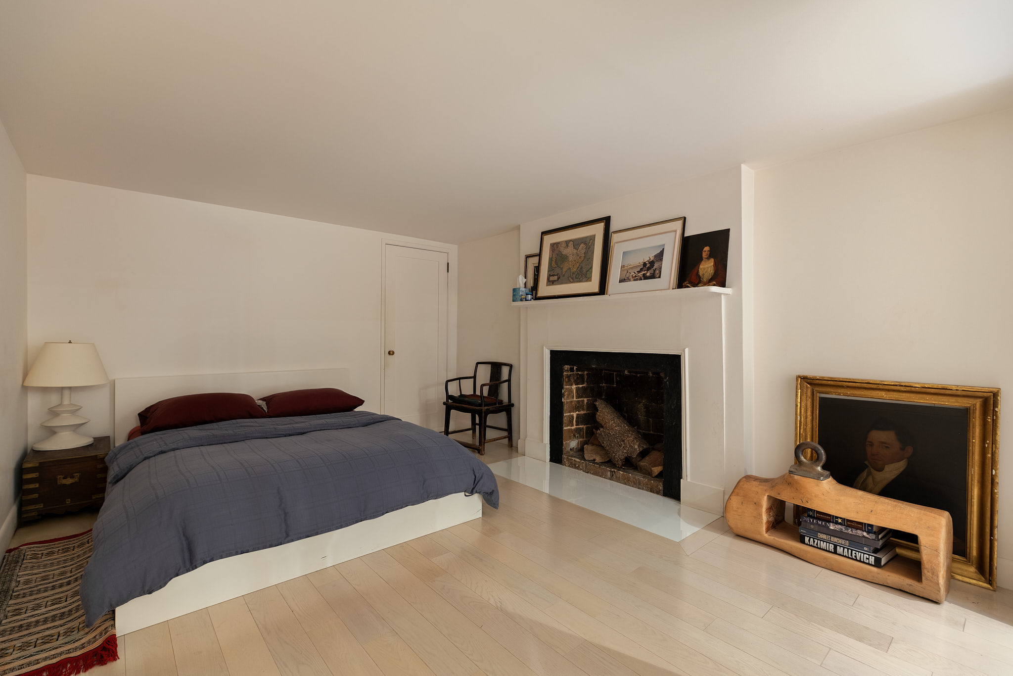 13 Vandam Street Manhattan, NY 10014 - Photo 24 of 26 a bedroom with a bed and a fireplace