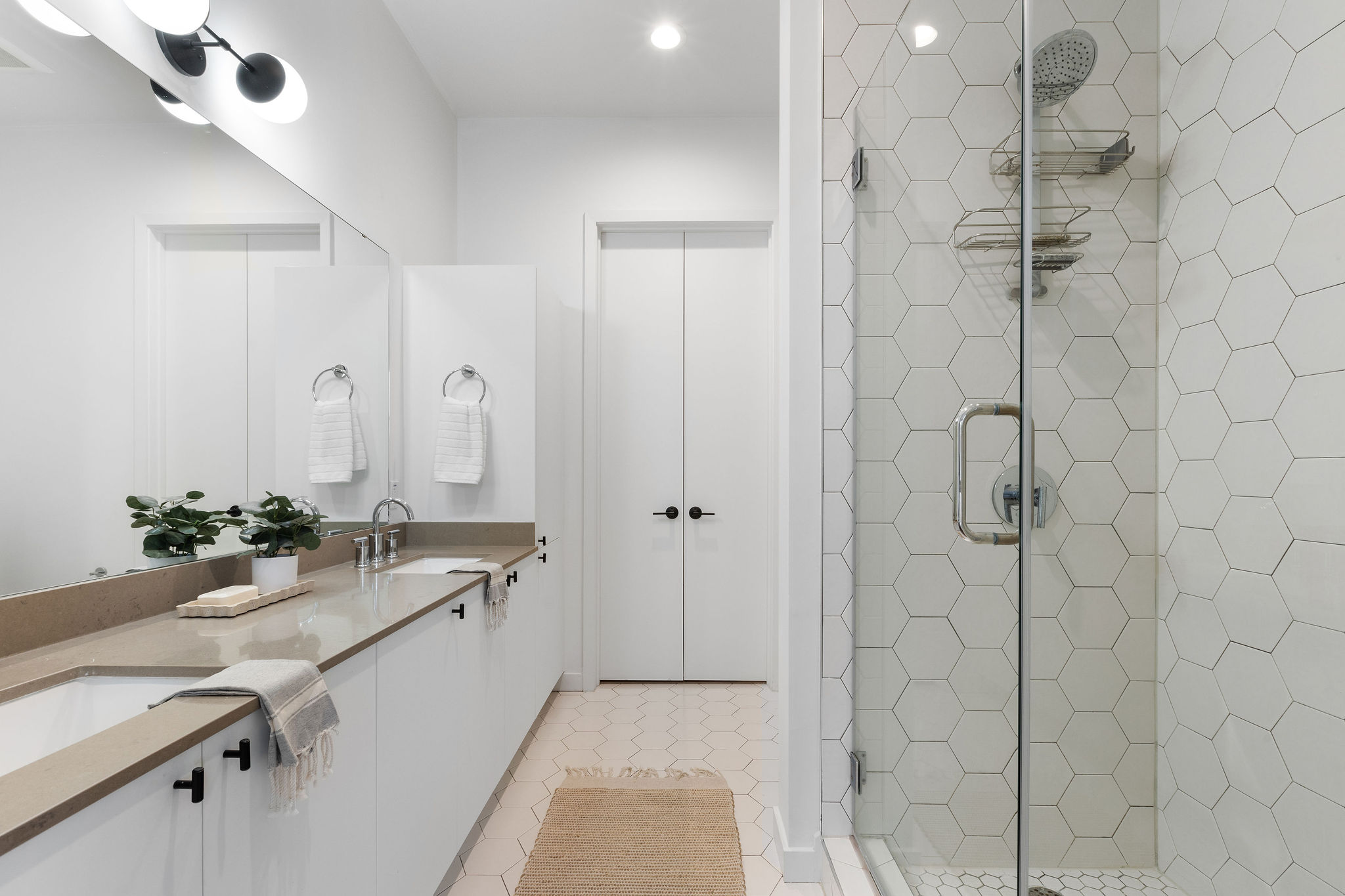 800 Embassy Drive, Unit 236 Austin, TX 78702 - Photo 9 of 50 a bathroom with a double vanity sink mirror and shower
