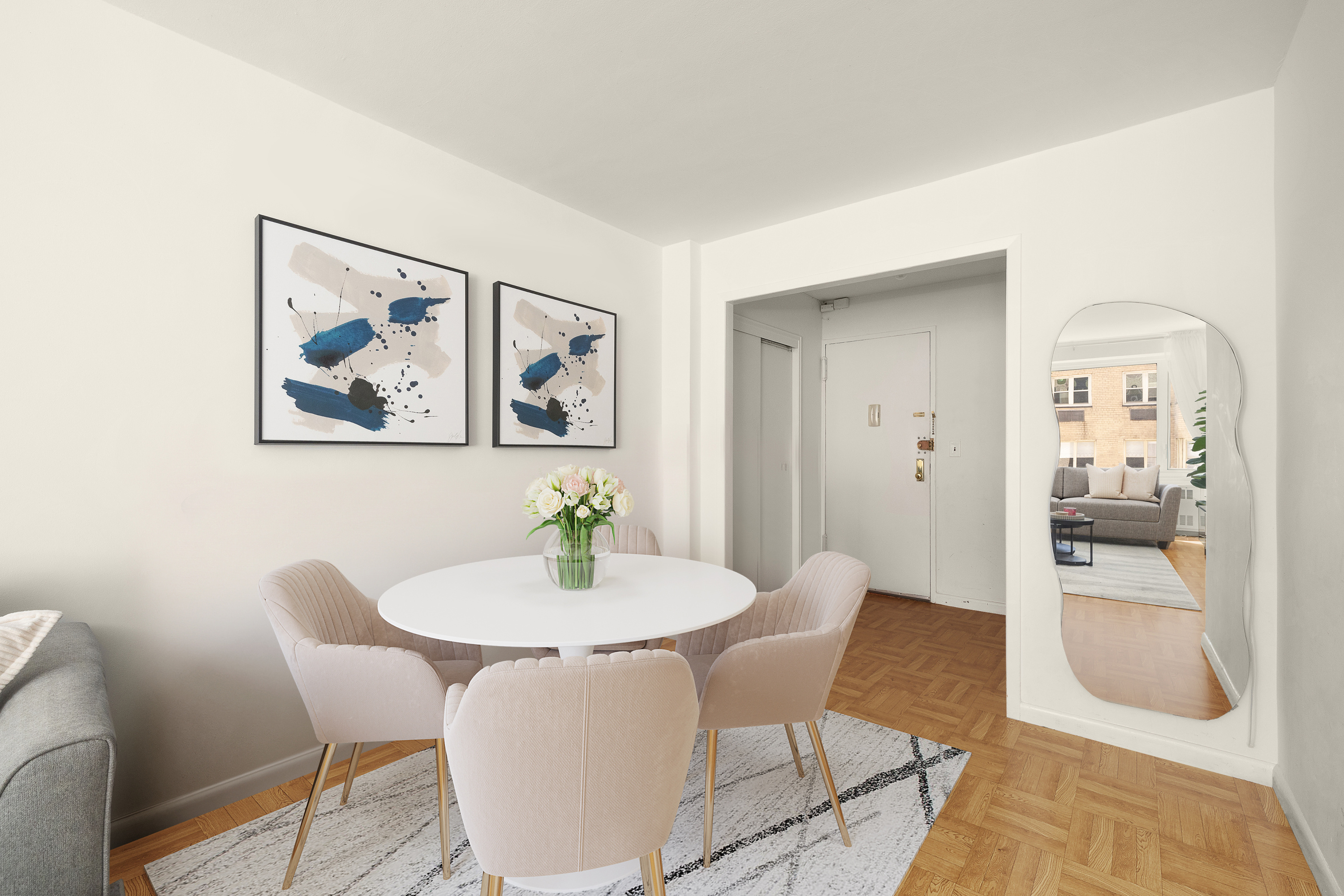 411 East 53rd Street, Unit 10E Manhattan, NY 10022 - Photo 3 of 8 a view of a dining room with furniture and wooden floor