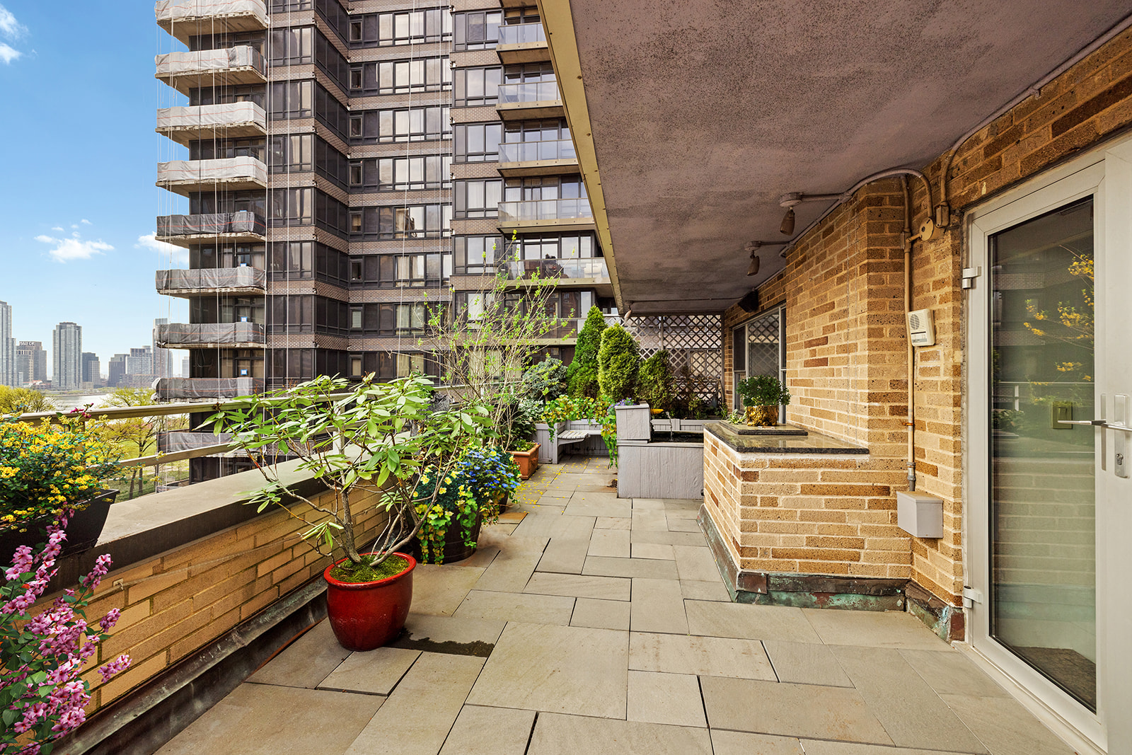 330 East 49th Street, Unit 12E Manhattan, NY 10017 - Photo 6 of 16 a view of a potted flower in the corridor