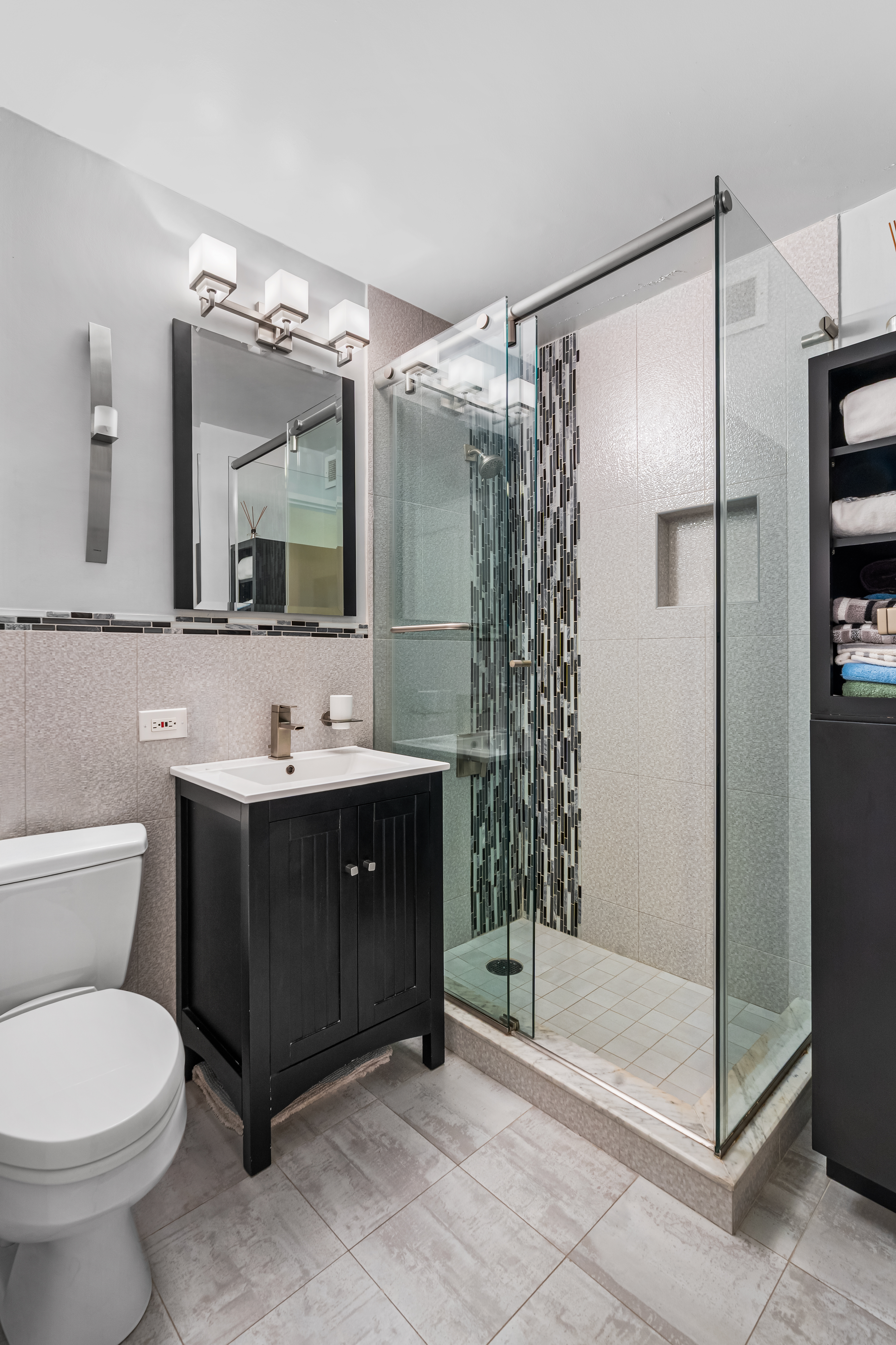 112-01 Queens Boulevard, Unit 6J Queens, NY 11375 - Photo 12 of 29 a bathroom with a sink toilet and shower