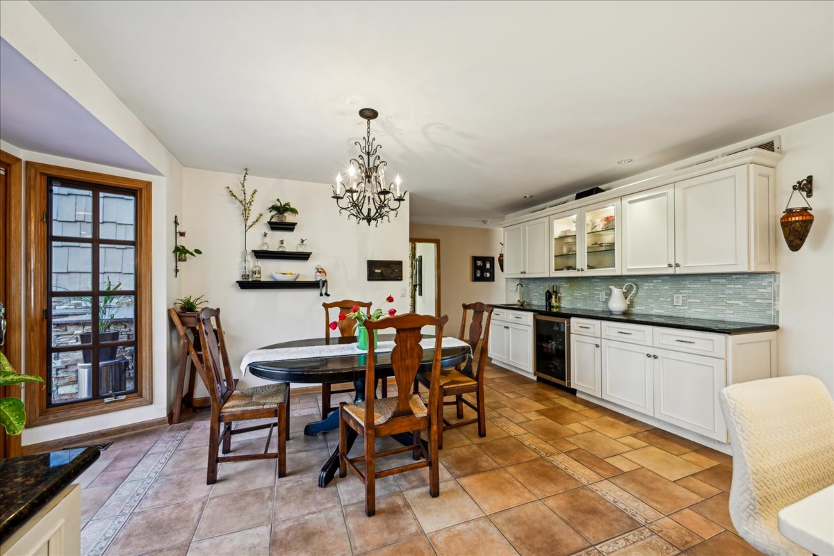 Johnston Drive Watchung, NJ 07069 - Photo 25 of 85 a view of a dining room with furniture and chandelier